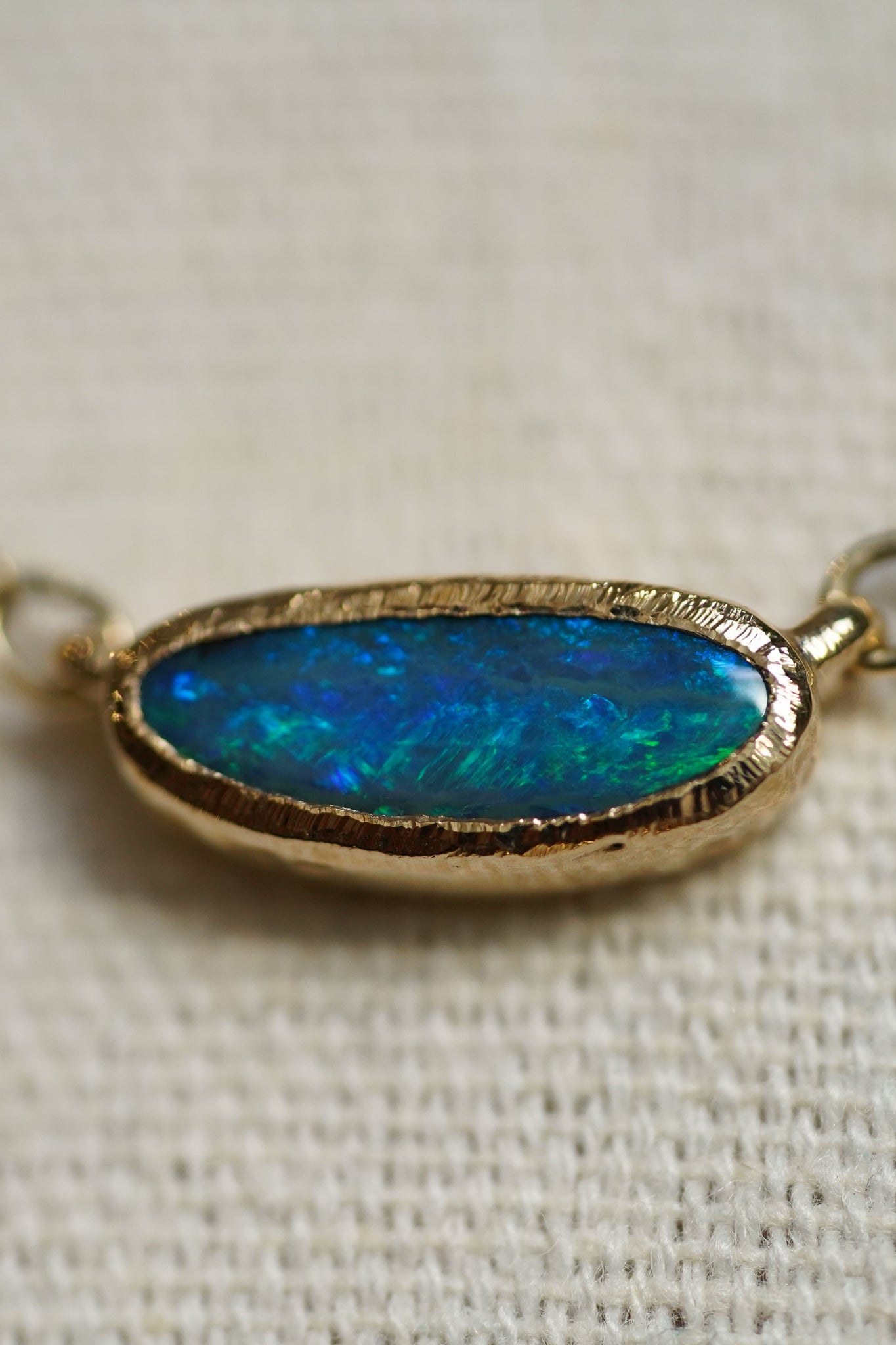 Solid gold east west boulder opal choker necklace