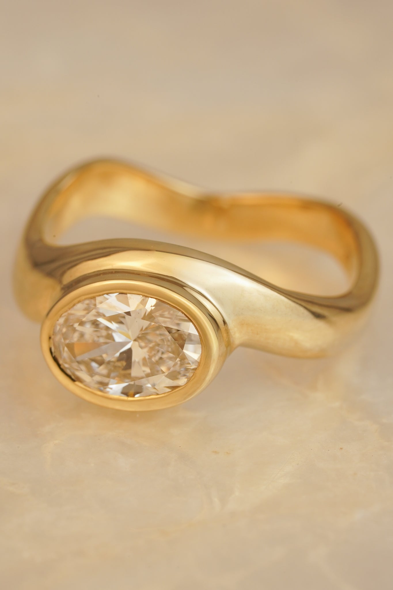 Solid gold oval diamond wave ring