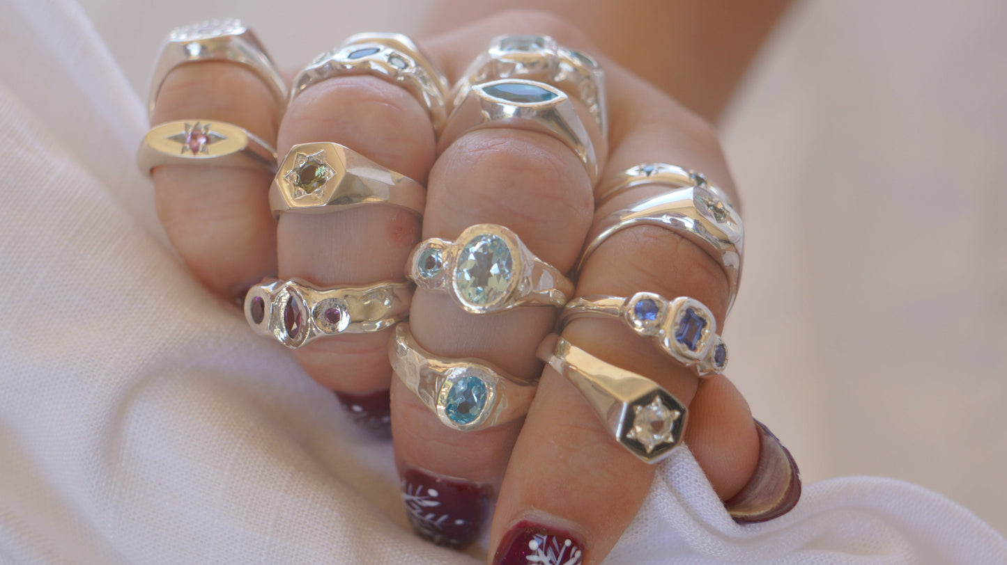 Slim oval signet with pink sapphire