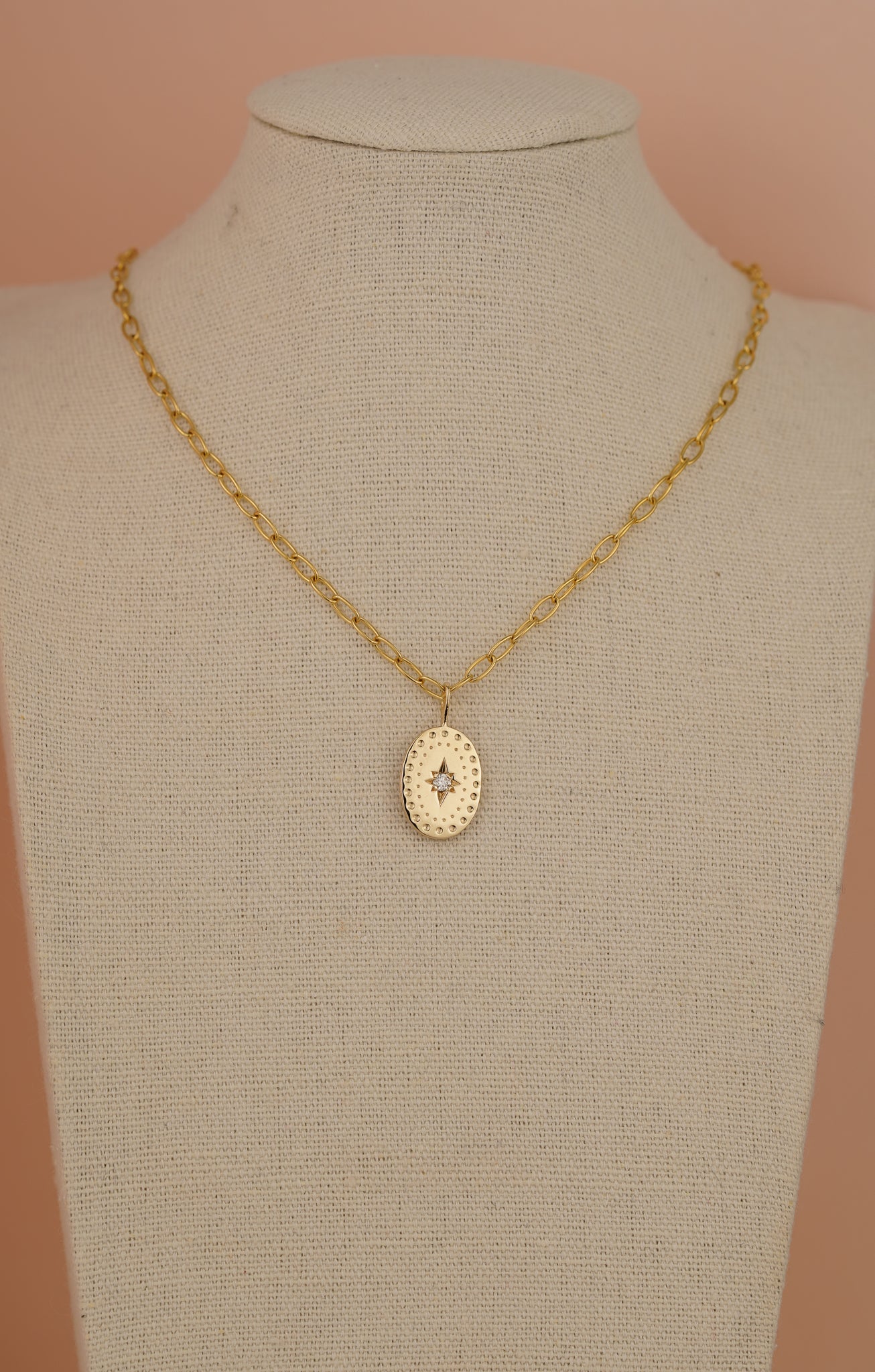 Solid gold large oval pendant with natural diamond