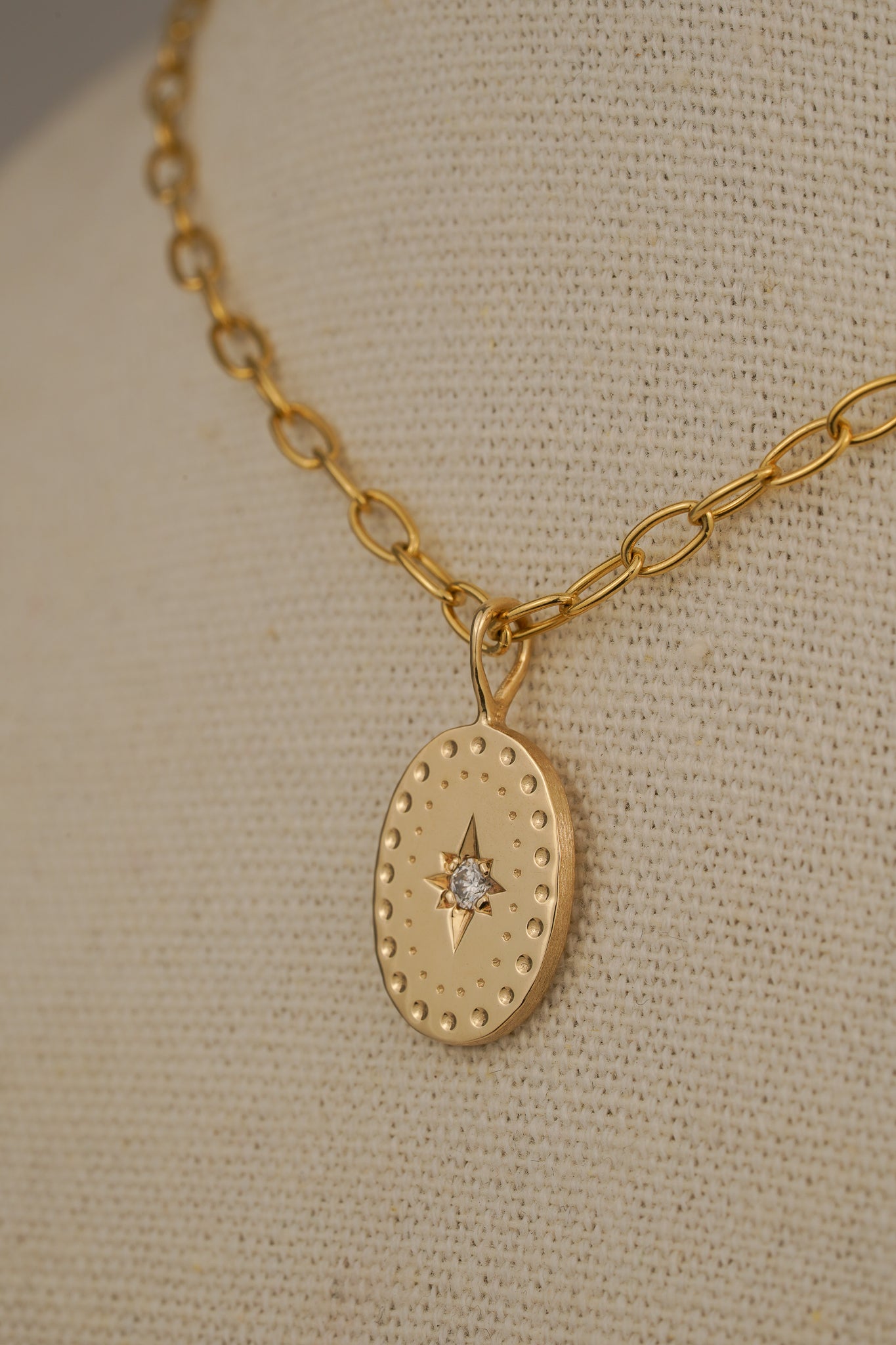 Solid gold large oval pendant with natural diamond