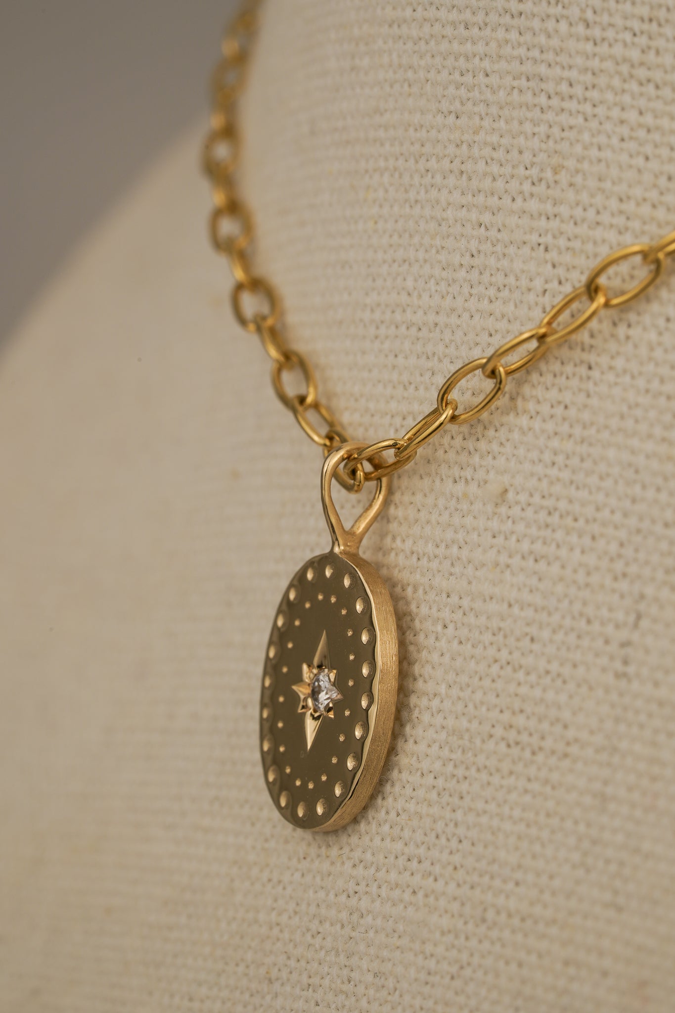 Solid gold large oval pendant with natural diamond
