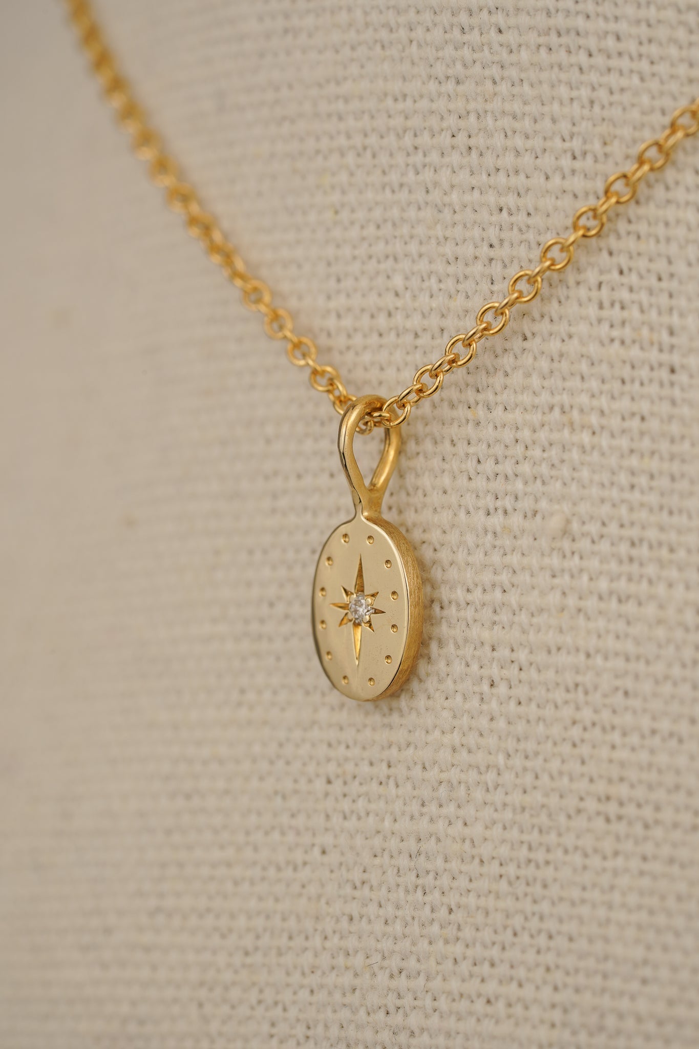 Solid gold tiny oval pendant with natural diamond