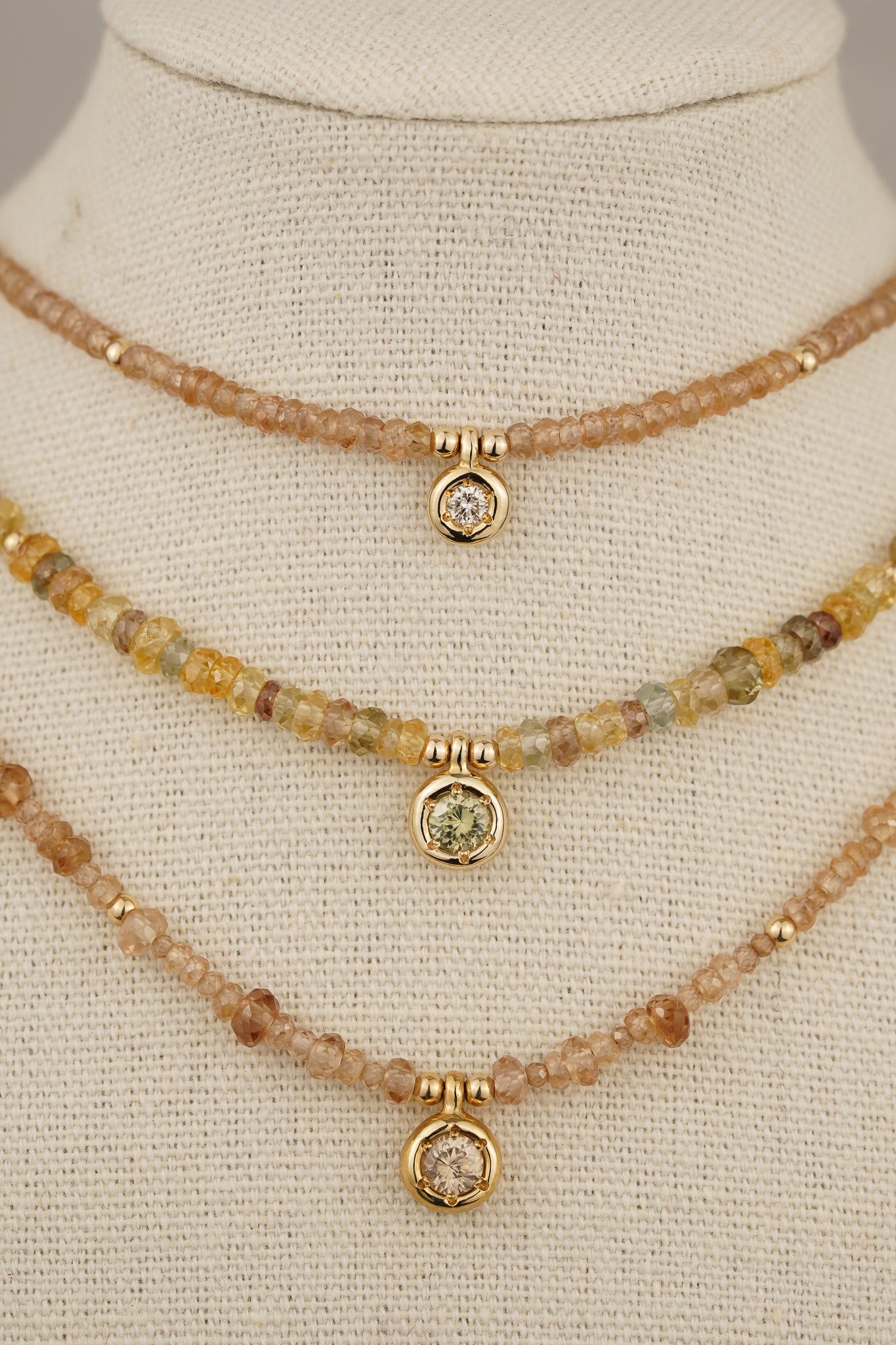 Solid gold mixed-colour zircon beaded necklace with green zircon pendant