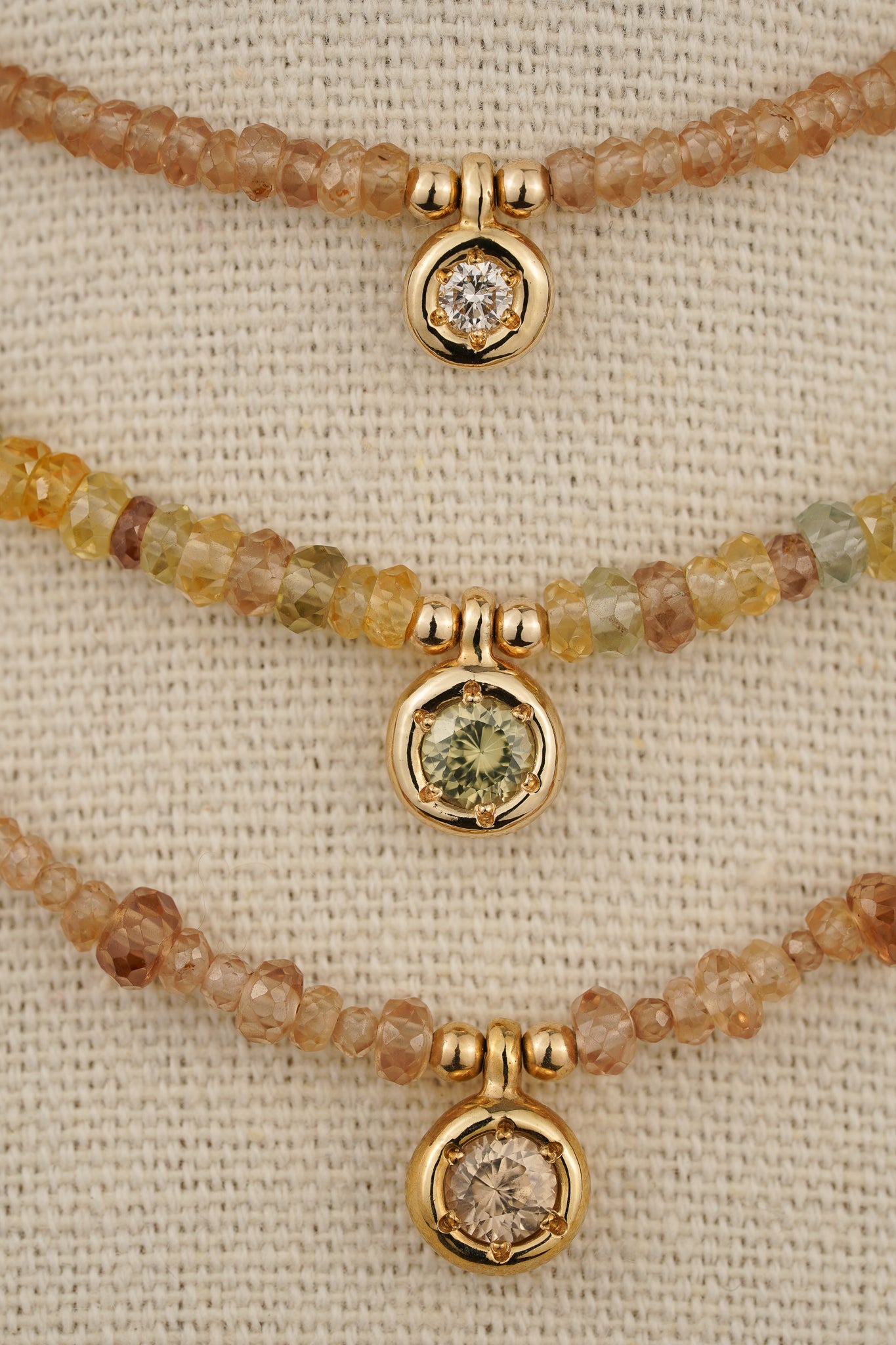 Solid gold mixed-colour zircon beaded necklace with green zircon pendant