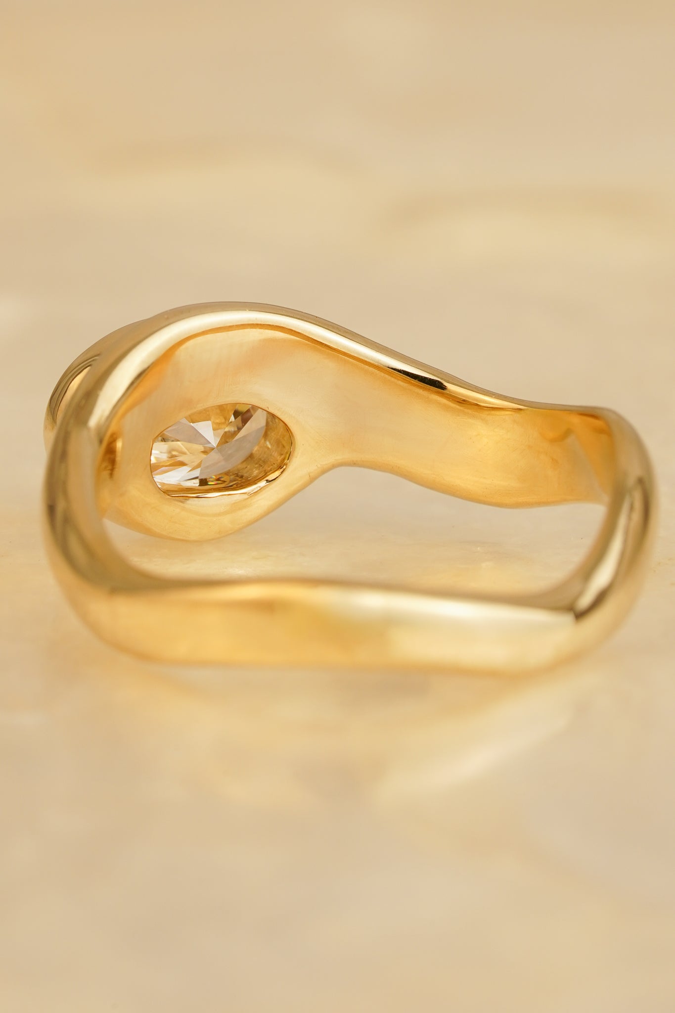 Solid gold oval diamond wave ring