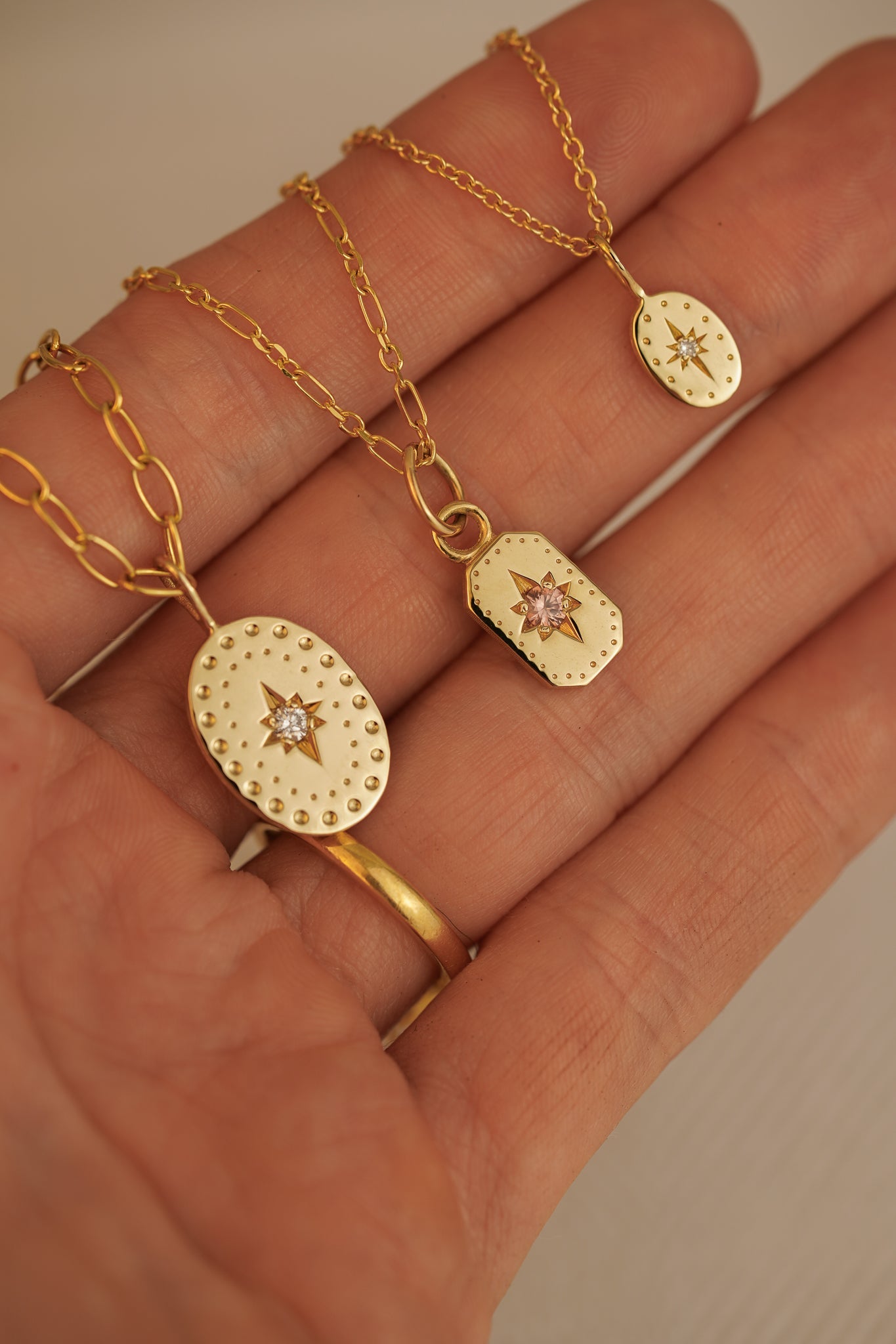 Solid gold tiny oval pendant with natural diamond