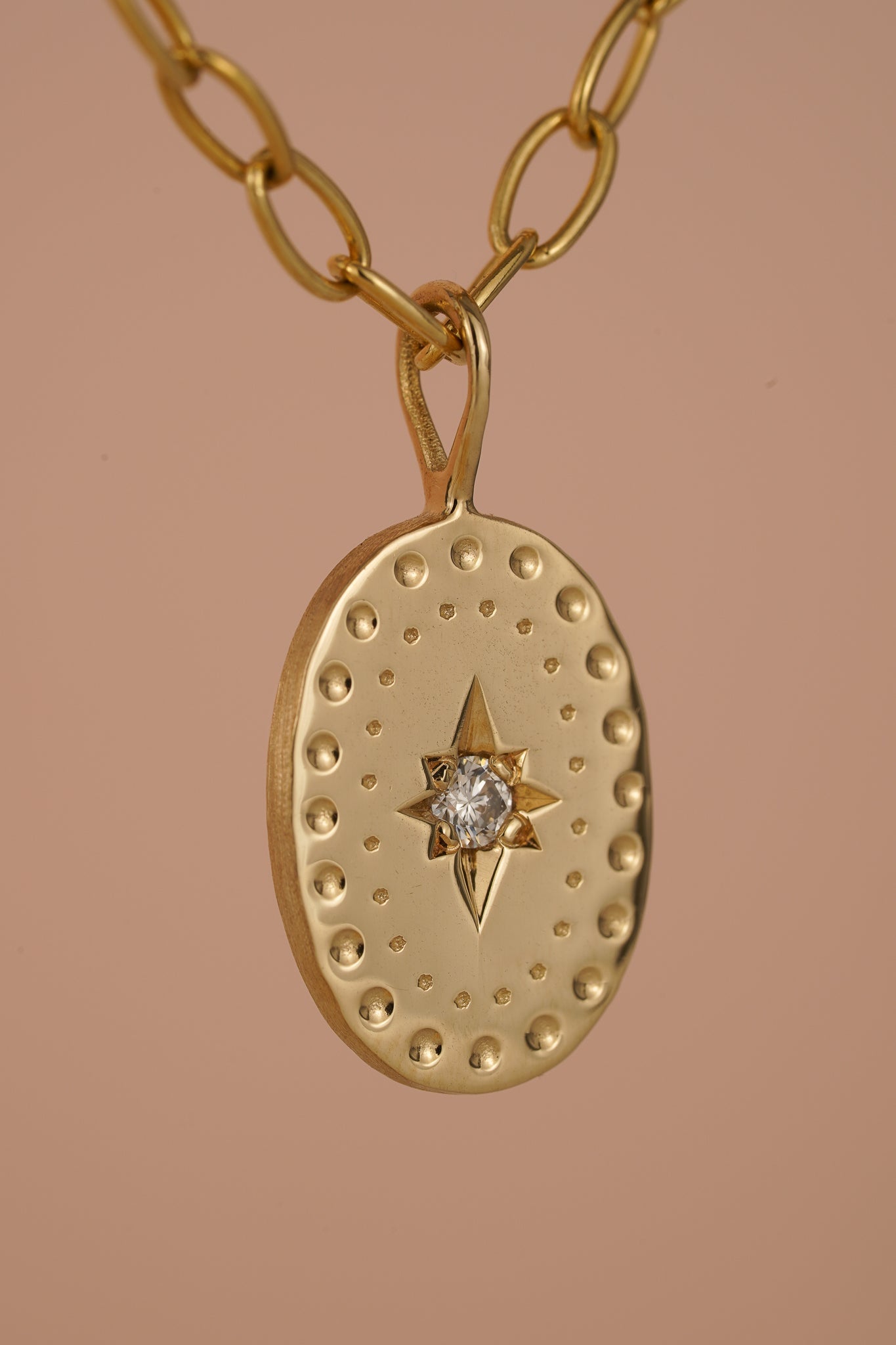 Solid gold large oval pendant with natural diamond