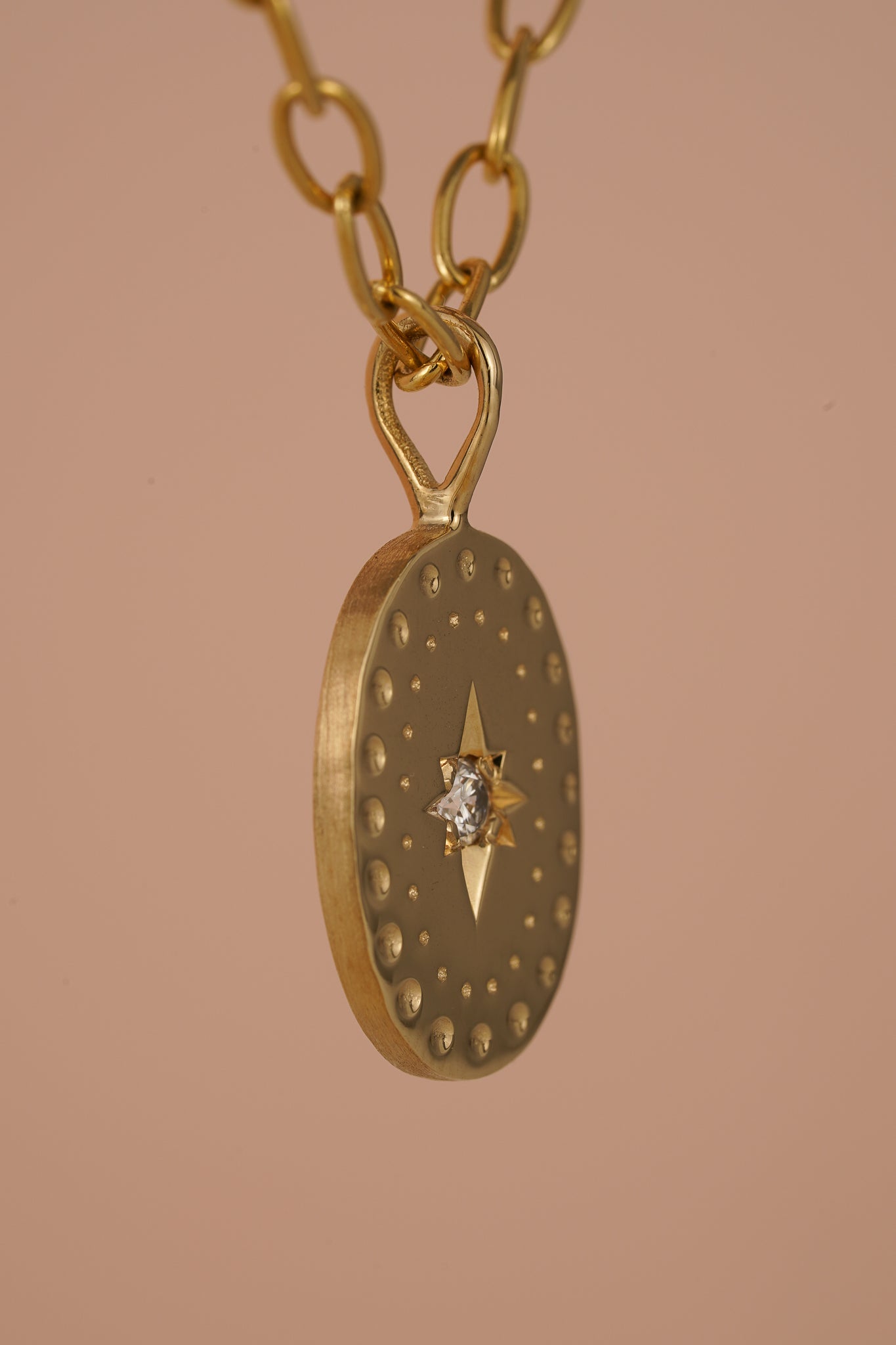 Solid gold large oval pendant with natural diamond