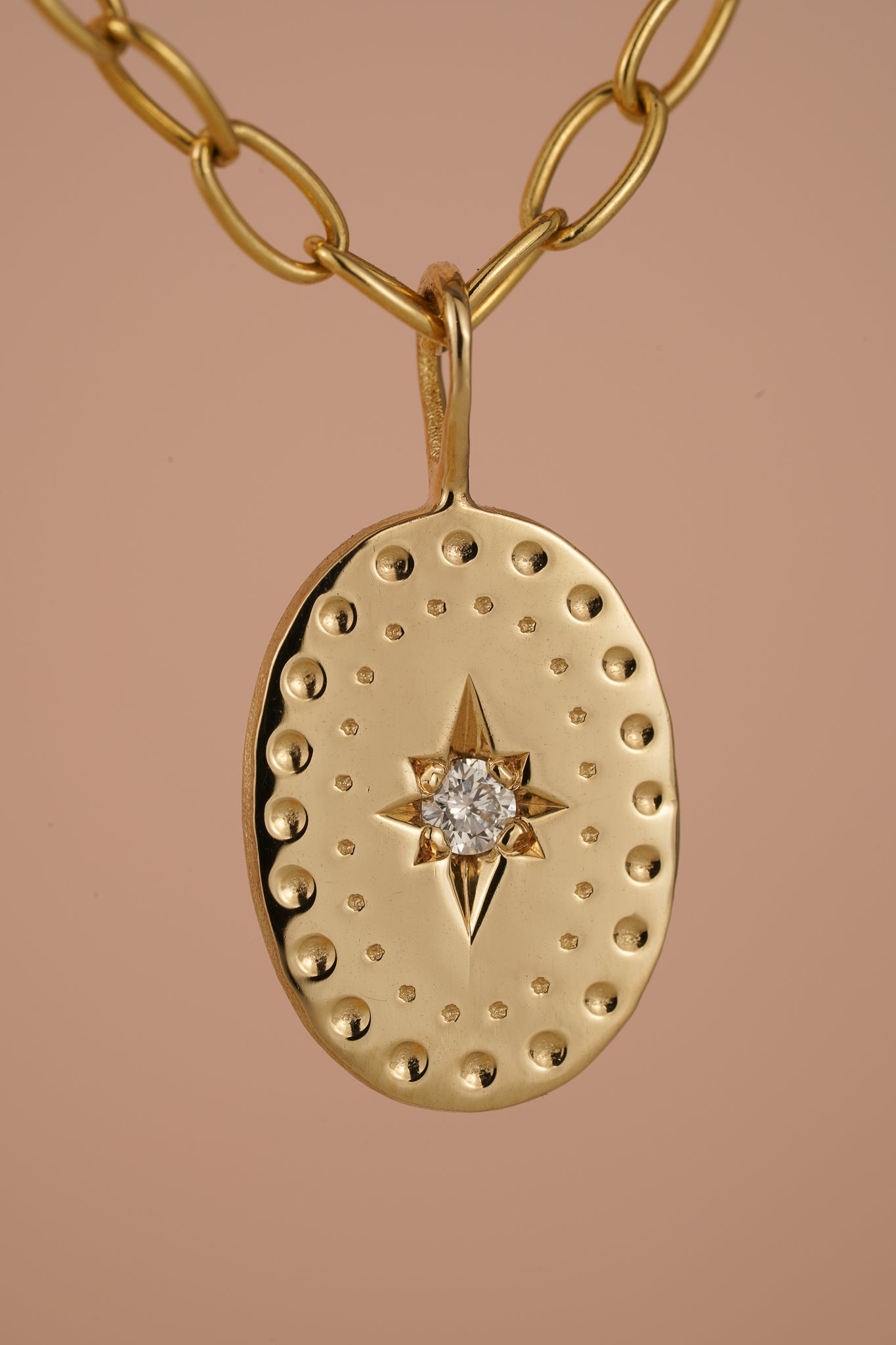 Solid gold large oval pendant with natural diamond