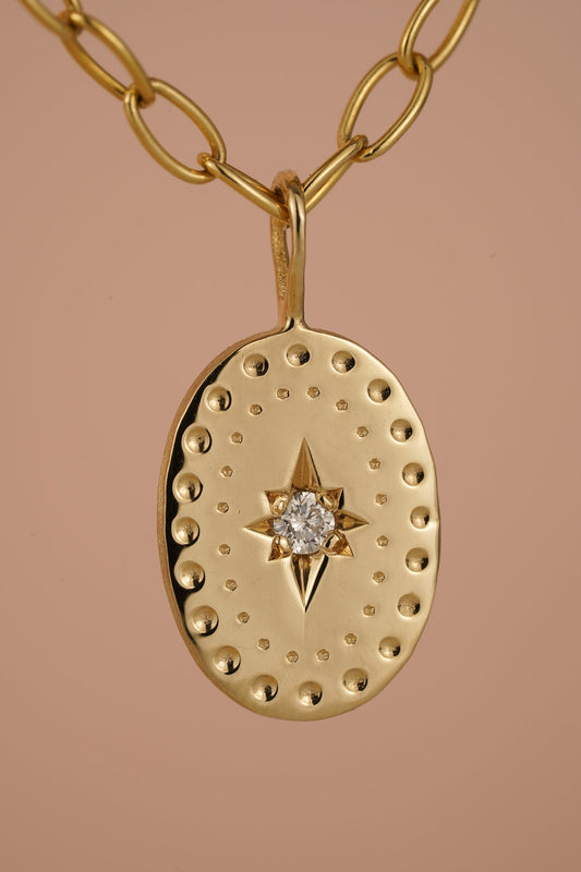 Solid gold large oval pendant with natural diamond