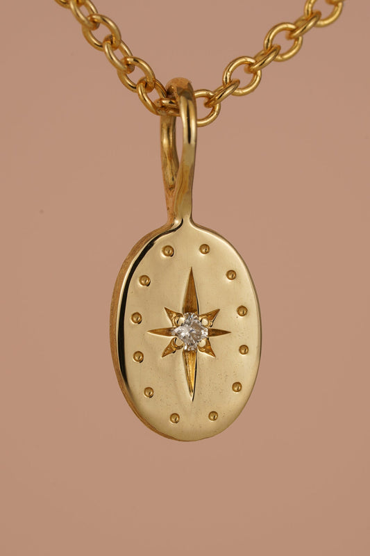 Solid gold tiny oval pendant with natural diamond