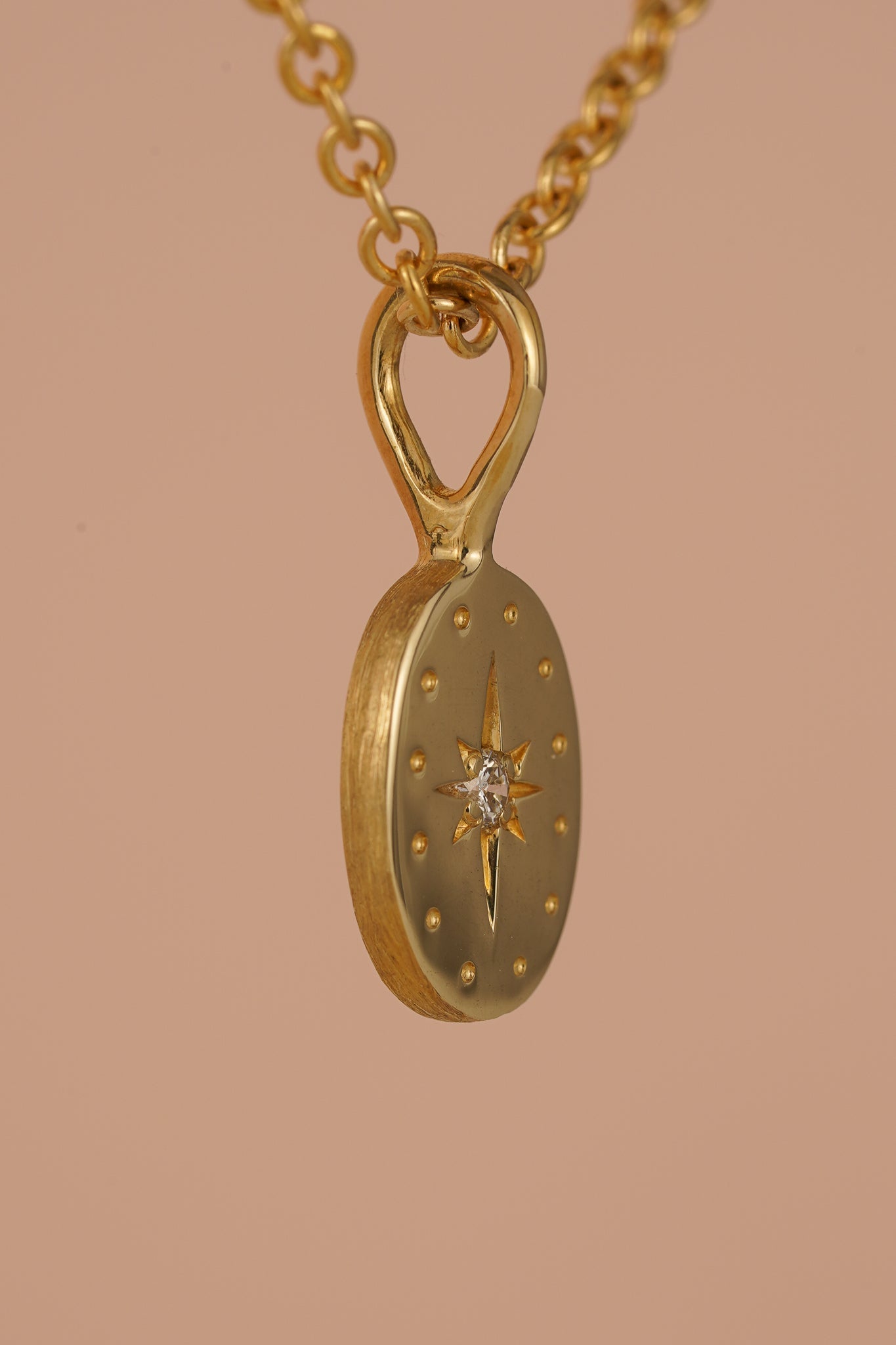 Solid gold tiny oval pendant with natural diamond