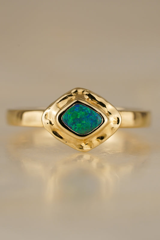 Solid gold blue-green boulder opal ring