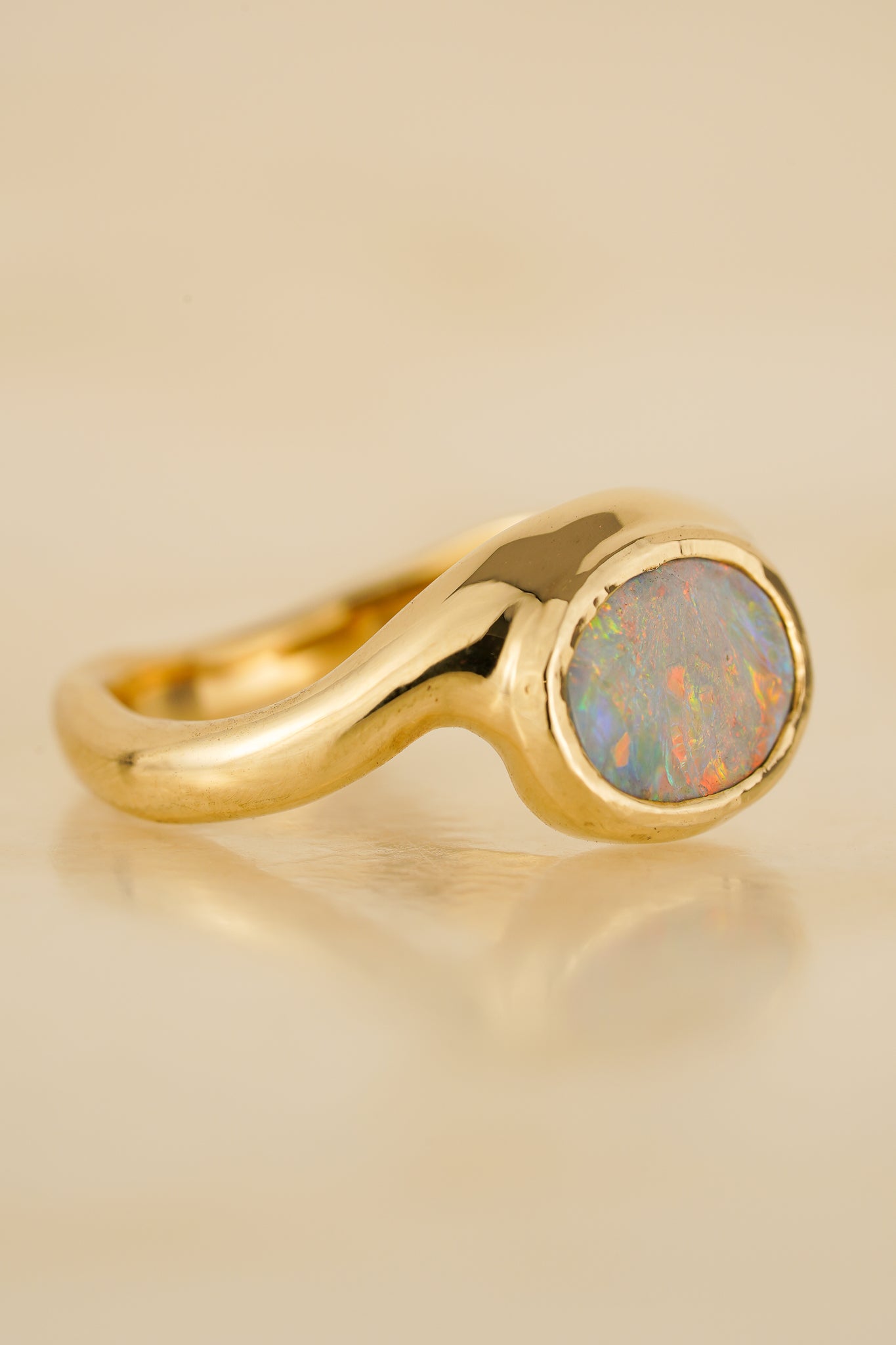 Solid gold pink opal wave ring