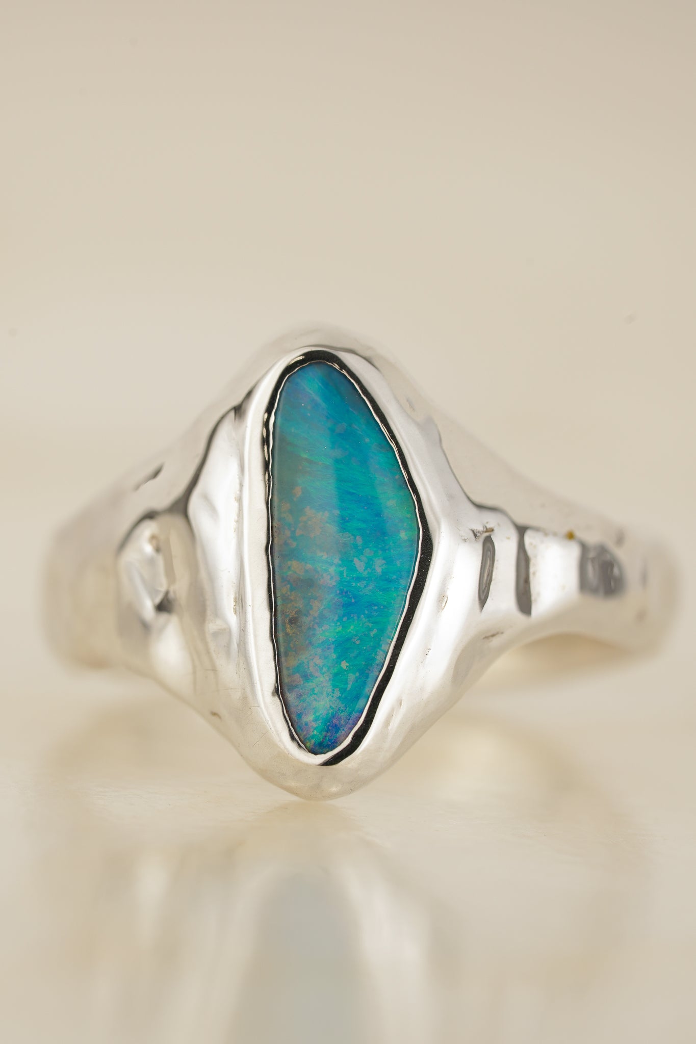 Bright blue boulder opal signet ring
