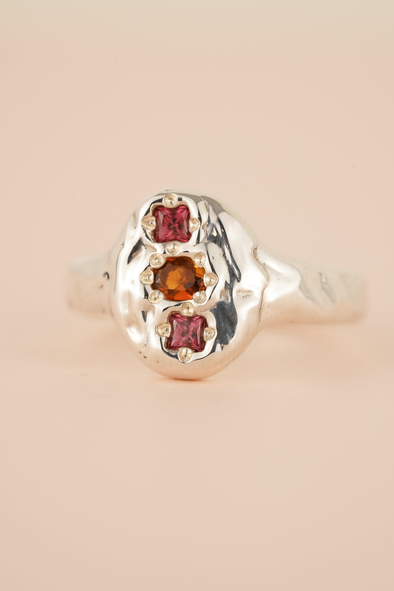 Molten signet with orange tourmaline & rhodolite garnet