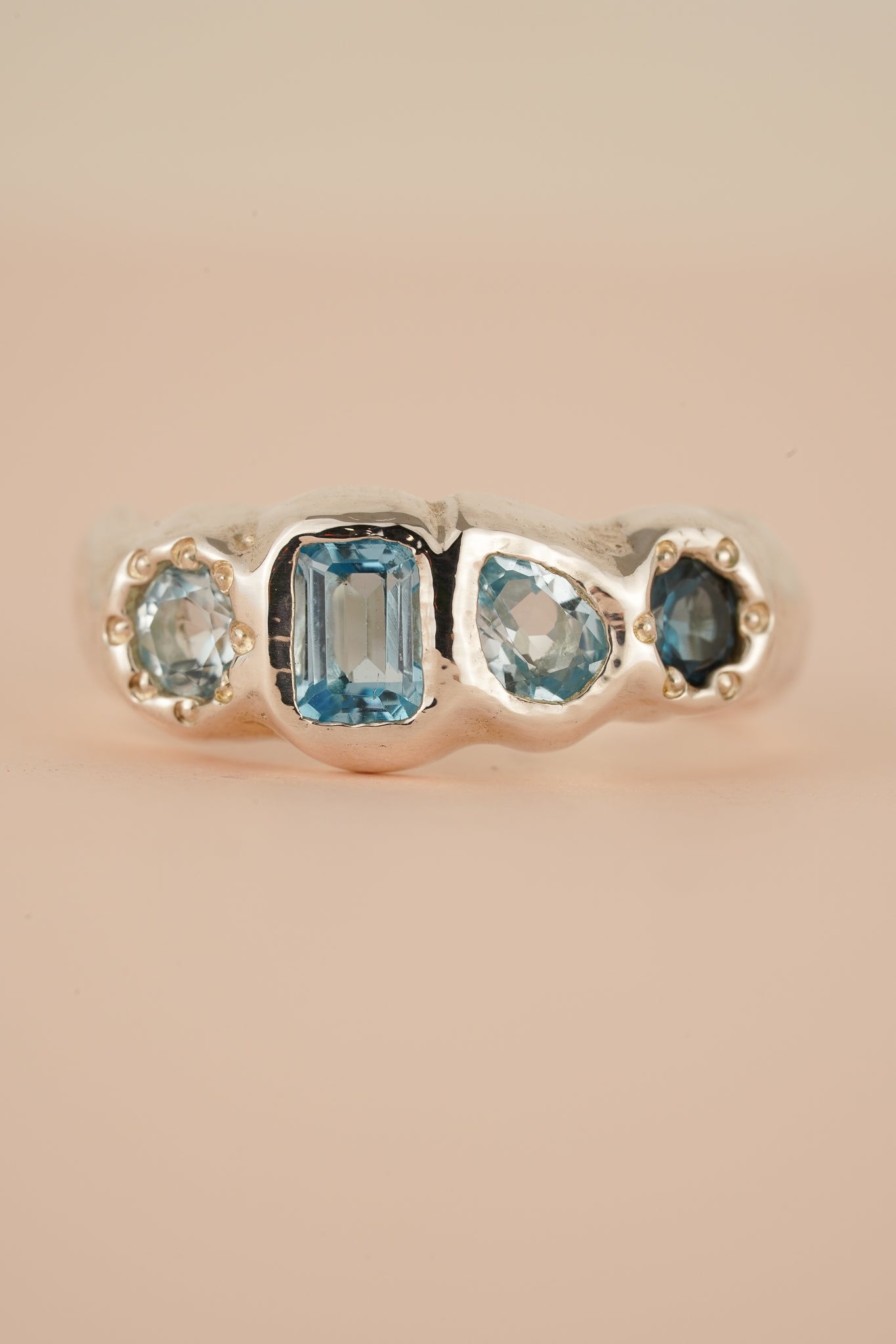 Four stone blue topaz band