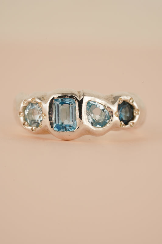 Four stone blue topaz band