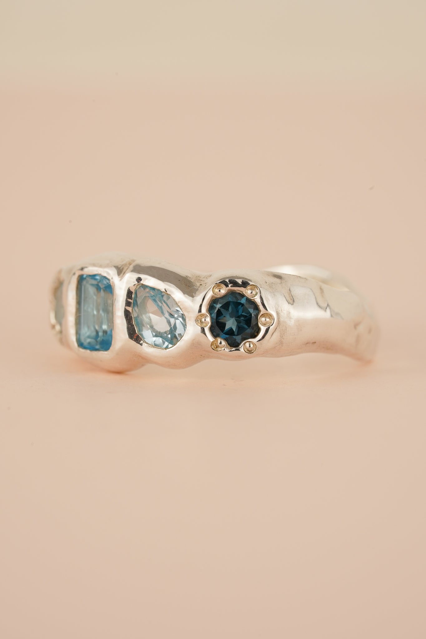 Four stone blue topaz band