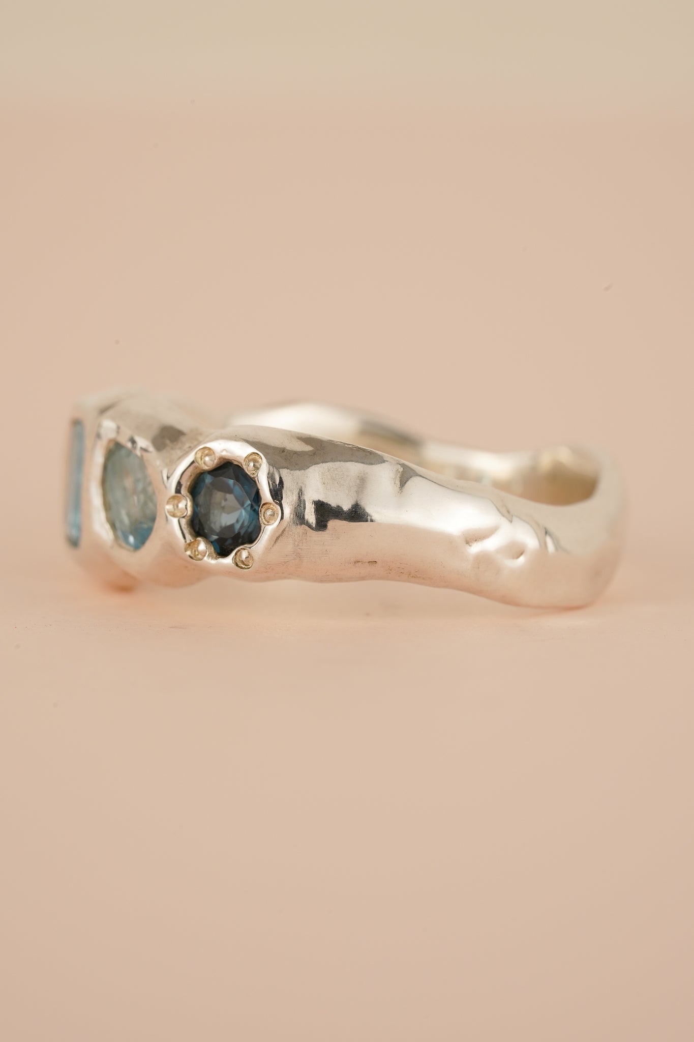 Four stone blue topaz band