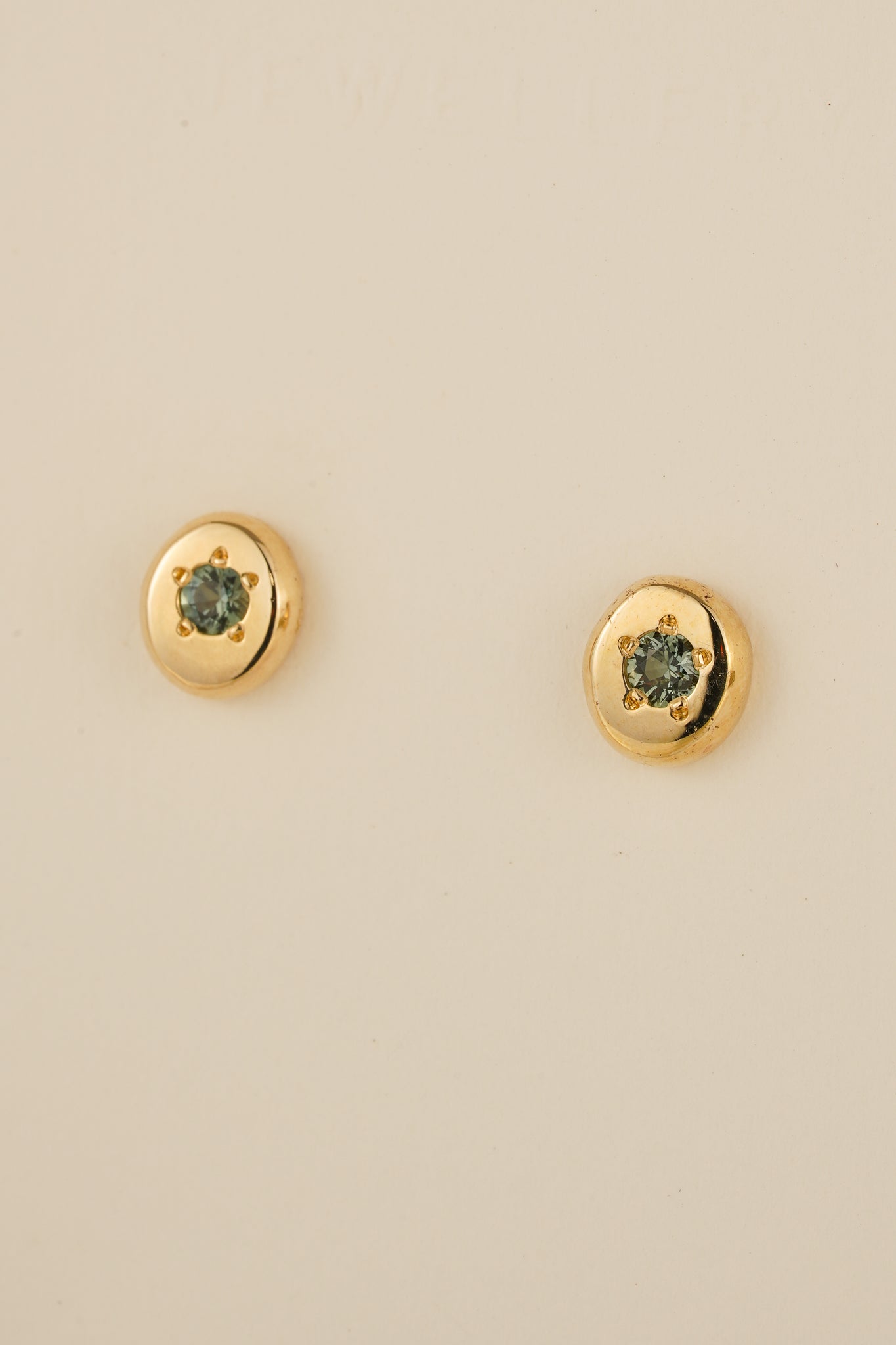 Solid gold teal Australian sapphire studs