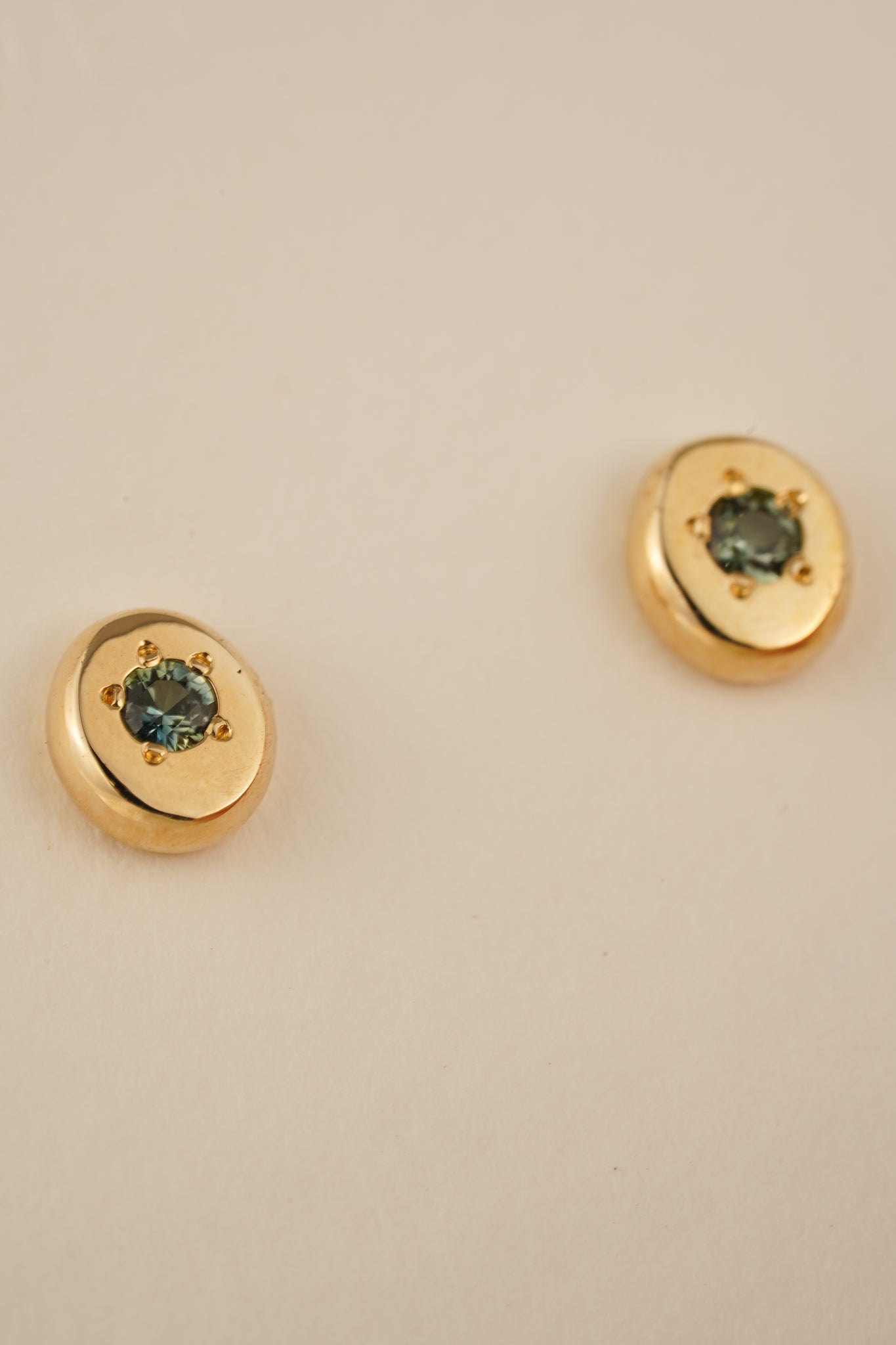 Solid gold teal Australian sapphire studs