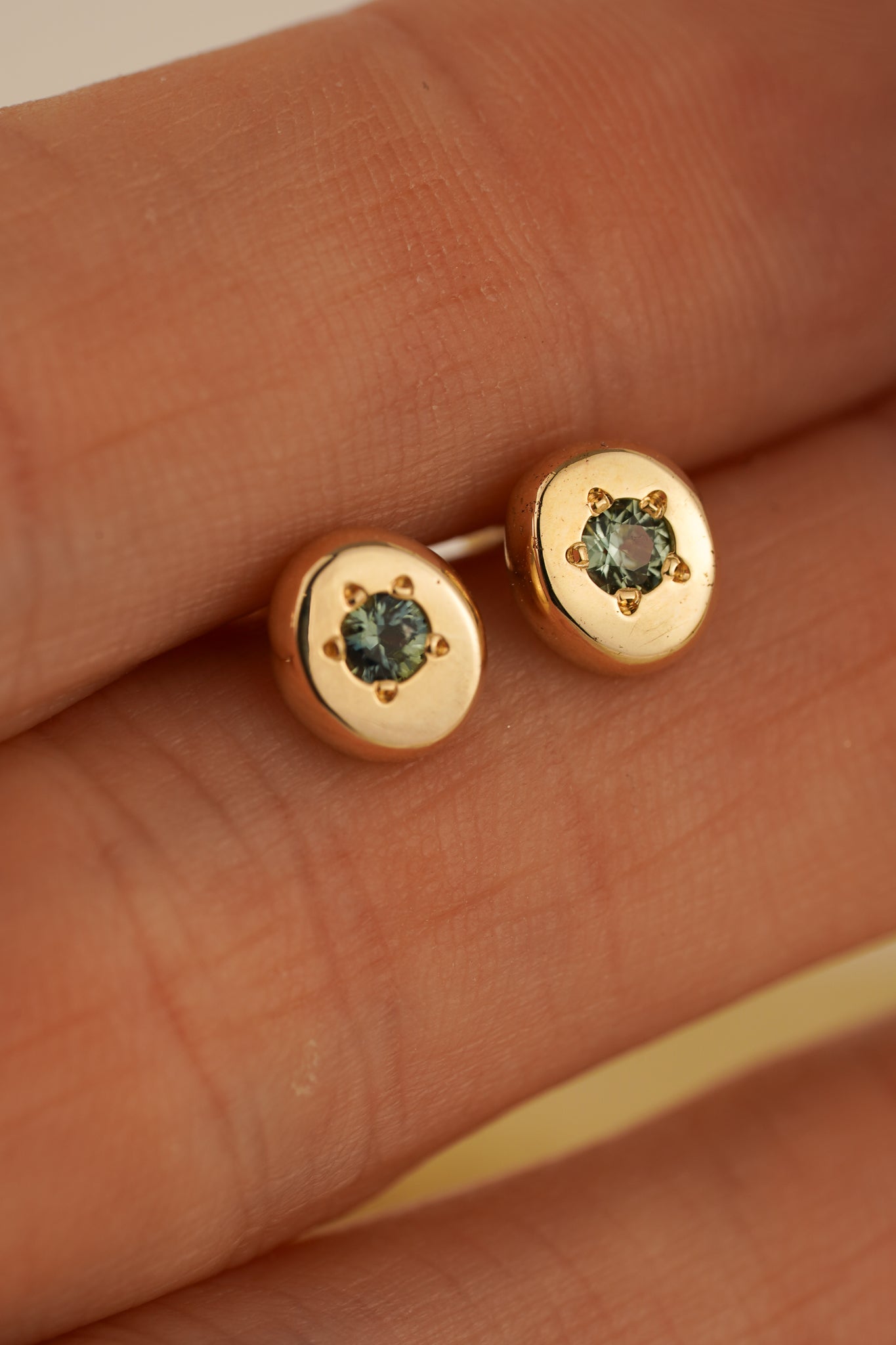 Solid gold teal Australian sapphire studs