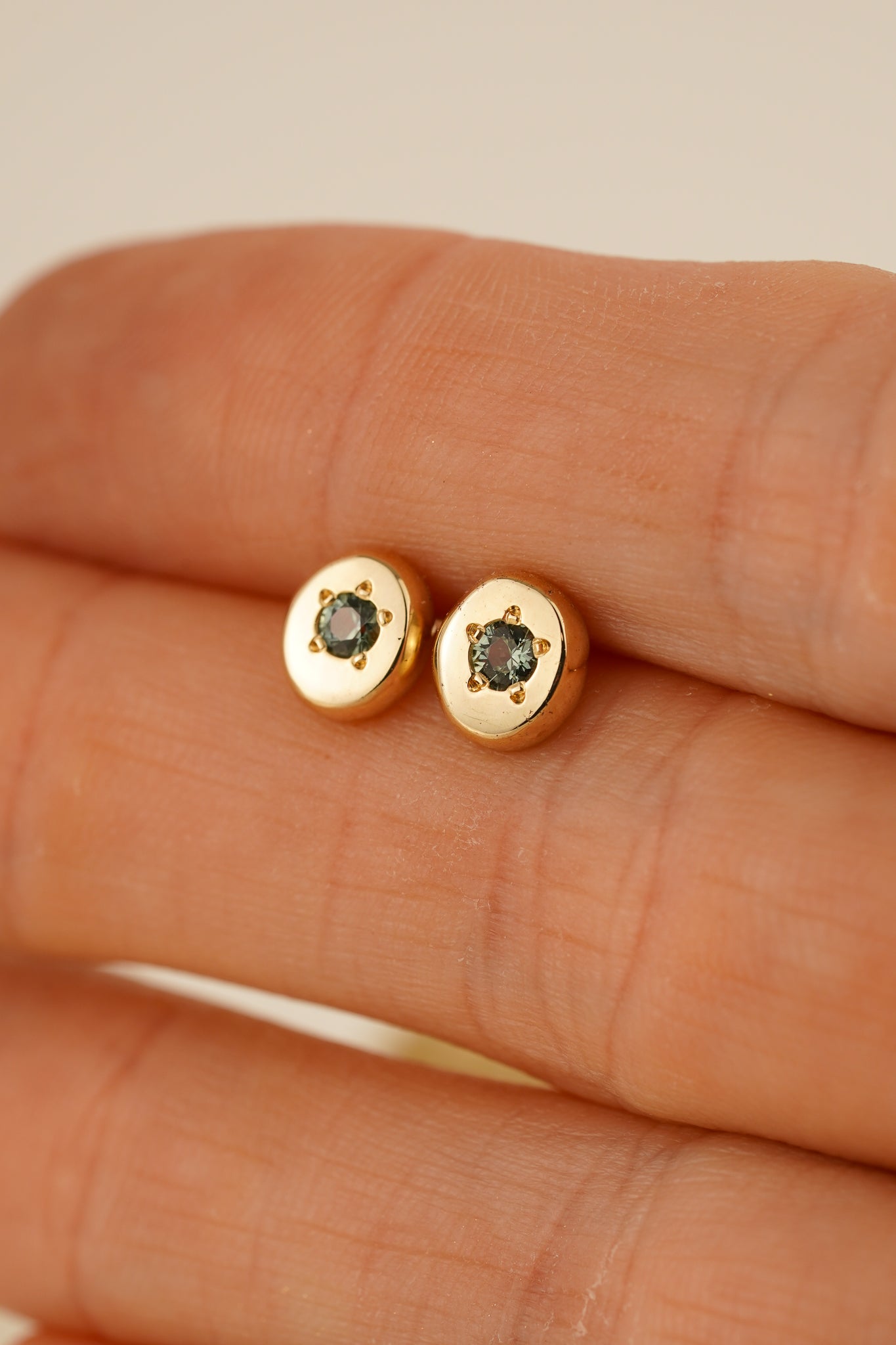 Solid gold teal Australian sapphire studs