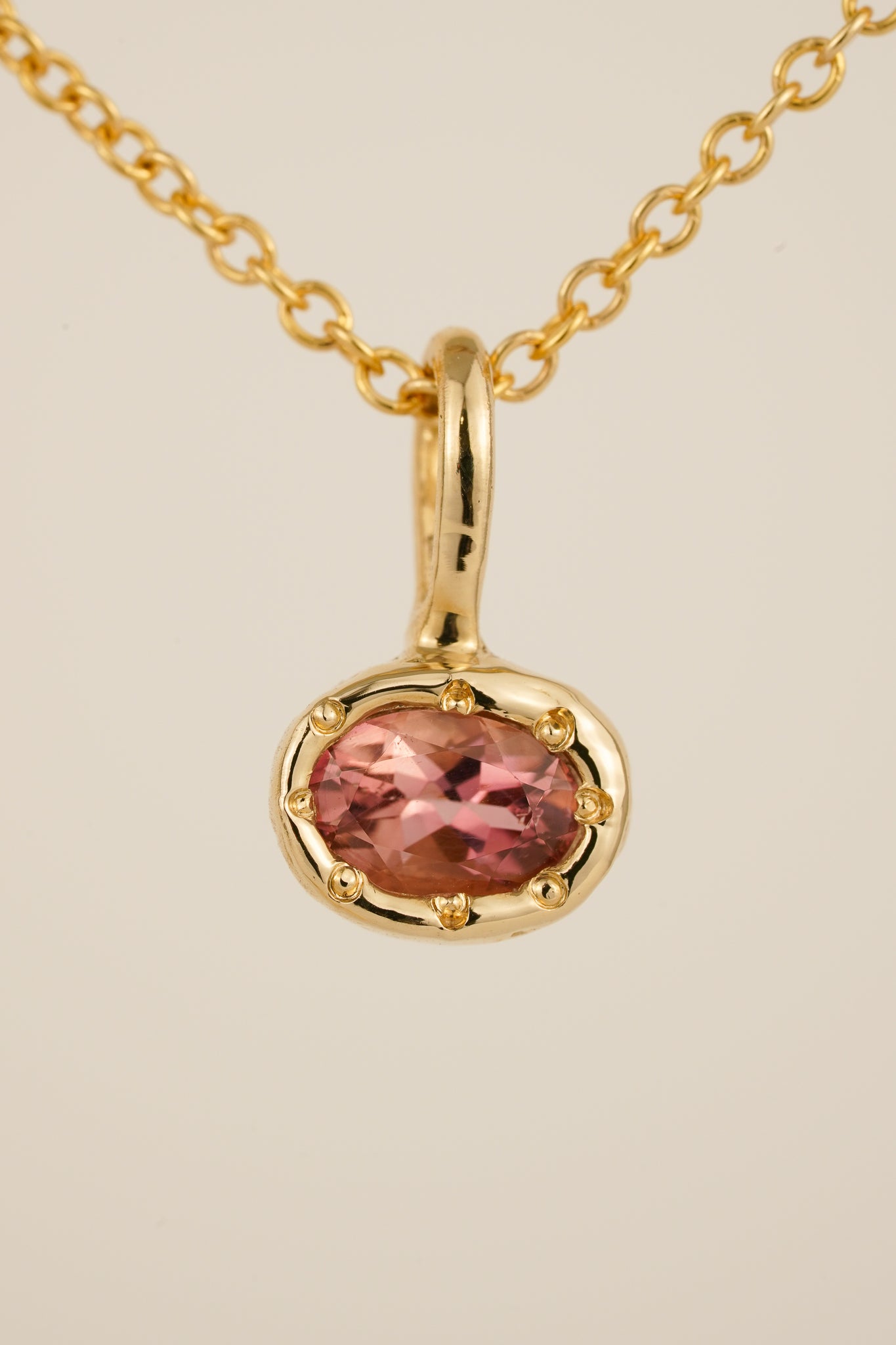 Solid gold pink tourmaline pendant