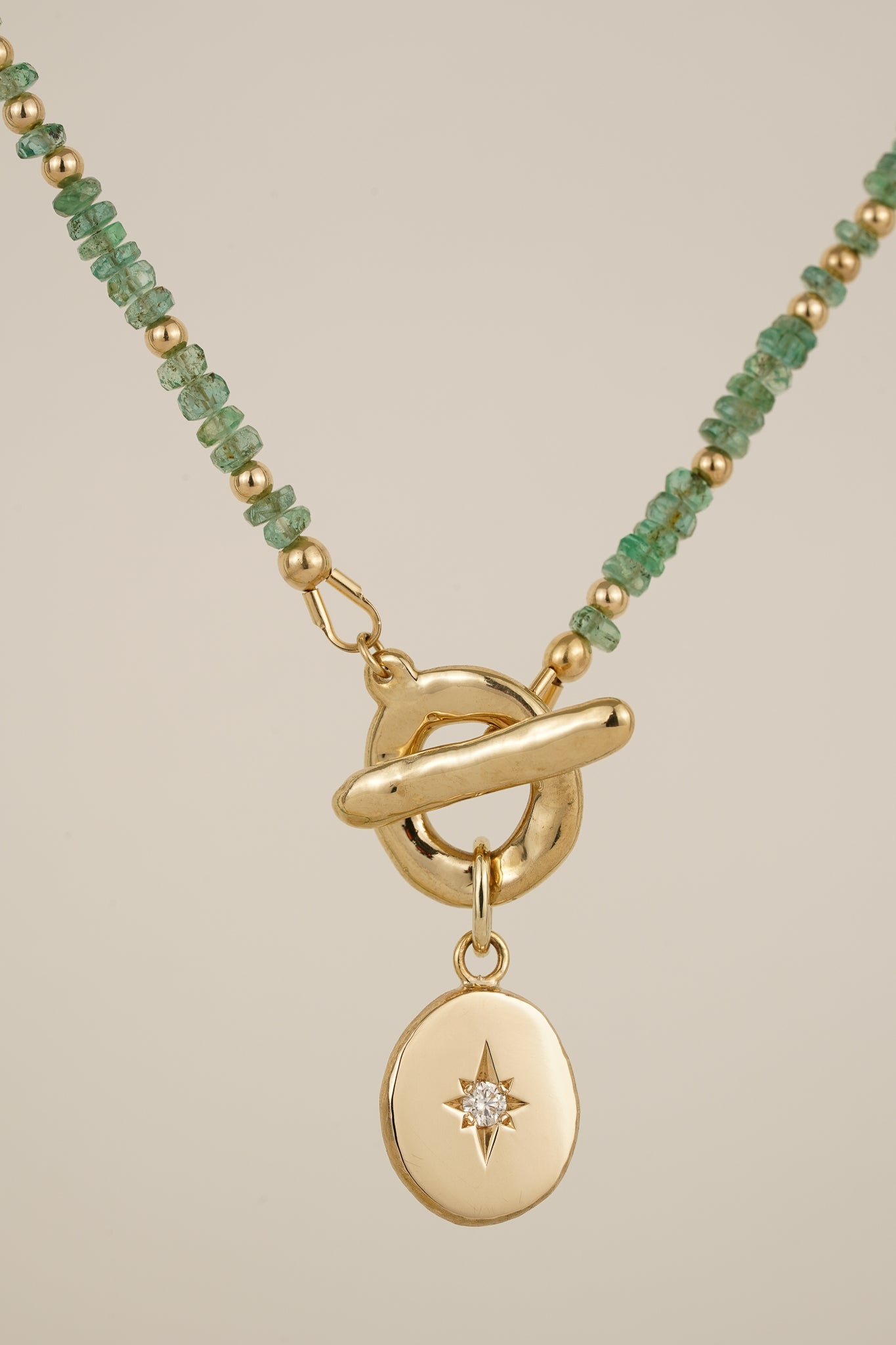 Emerald beaded necklace with solid gold toggle clasp & diamond pendant