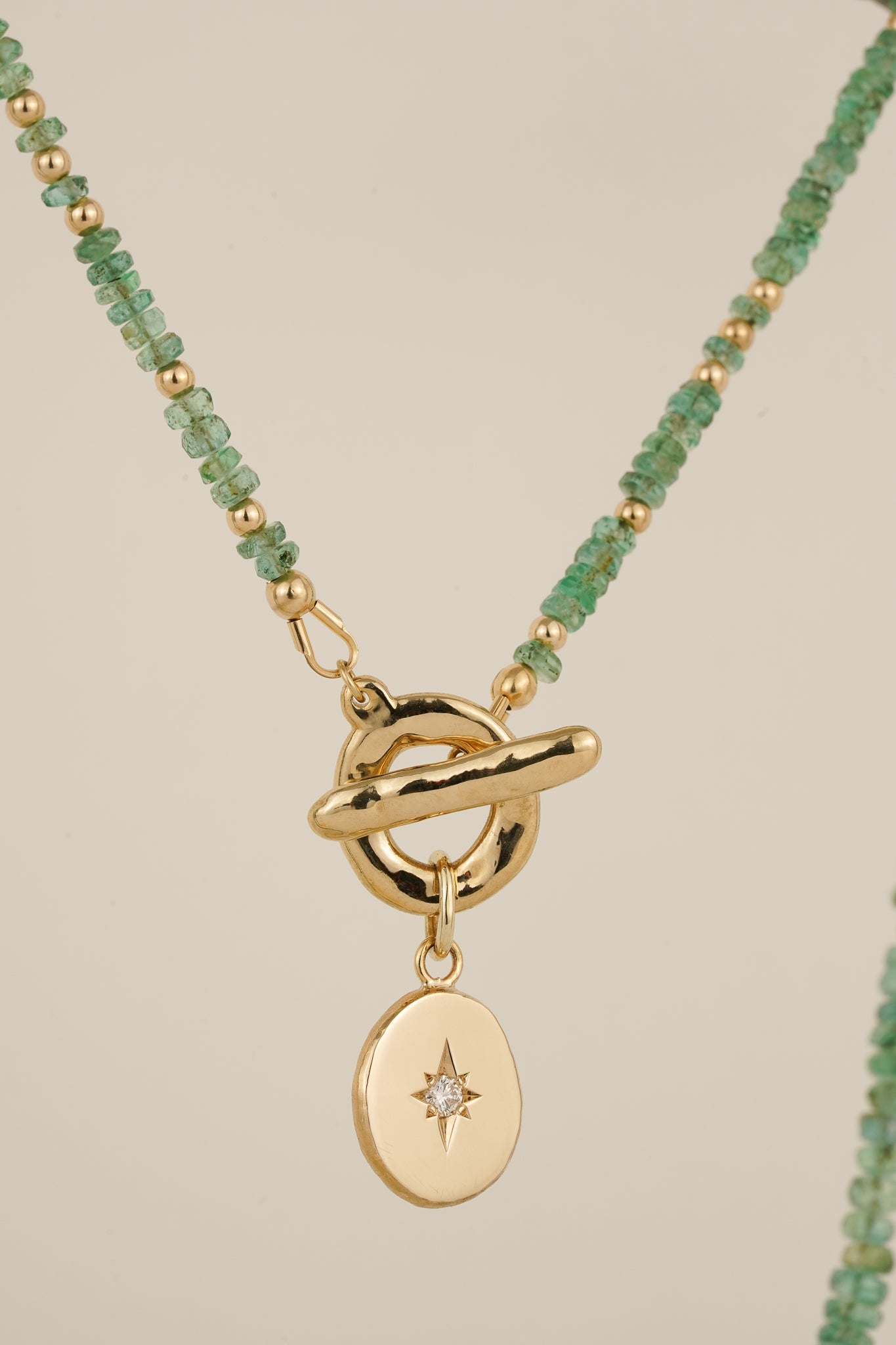 Emerald beaded necklace with solid gold toggle clasp & diamond pendant