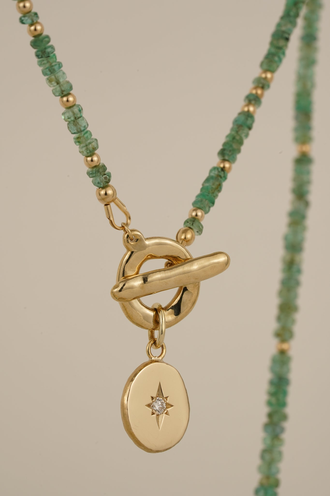 Emerald beaded necklace with solid gold toggle clasp & diamond pendant