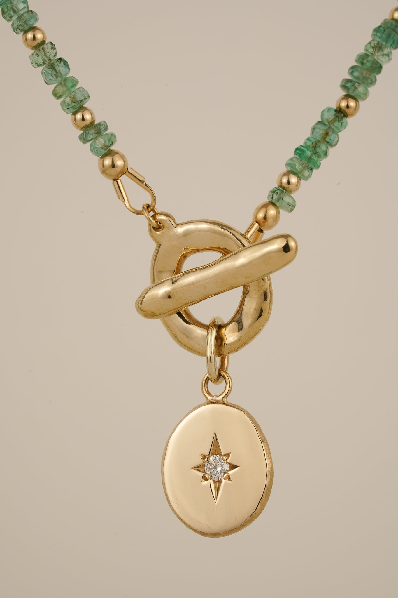 Emerald beaded necklace with solid gold toggle clasp & diamond pendant