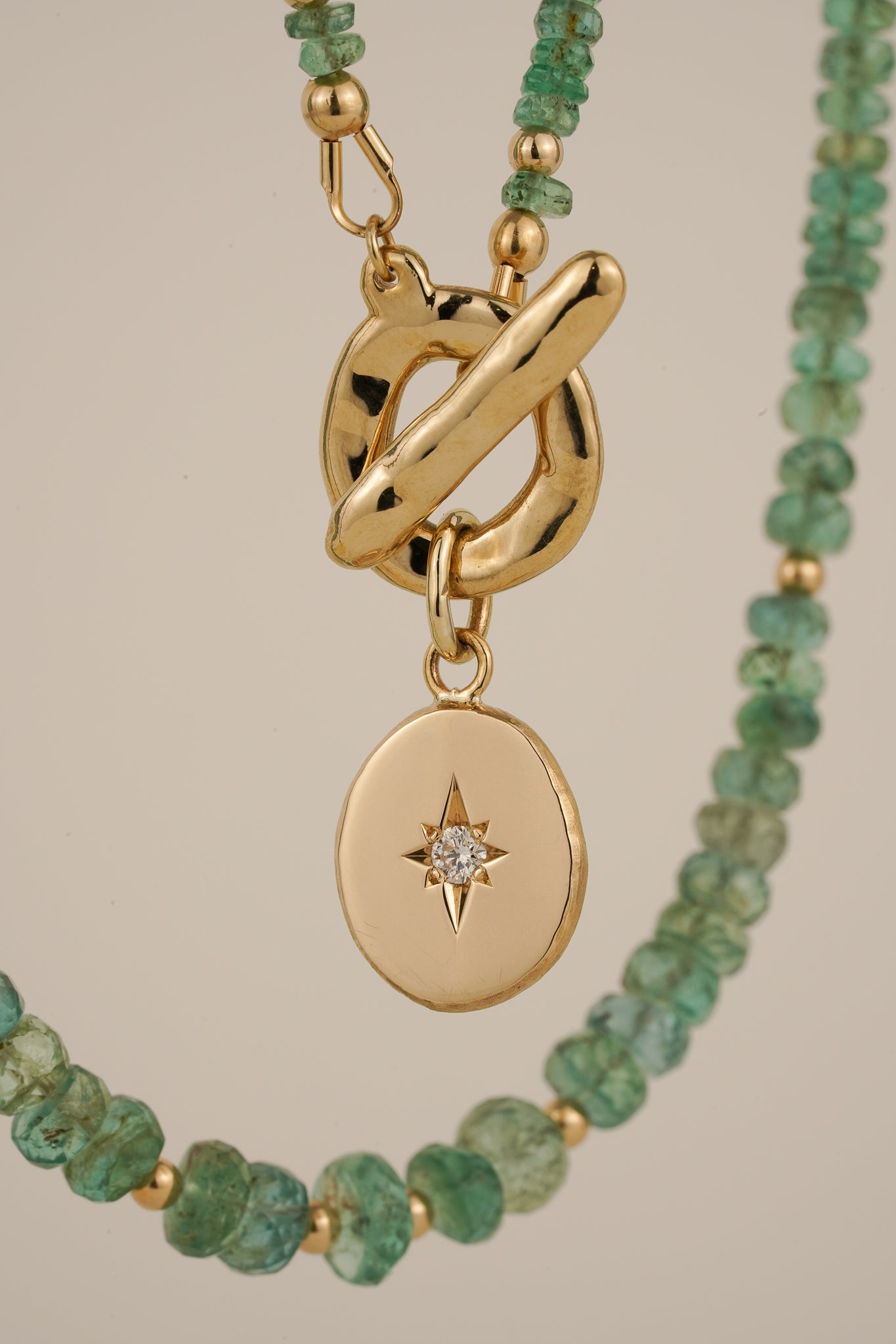 Emerald beaded necklace with solid gold toggle clasp & diamond pendant