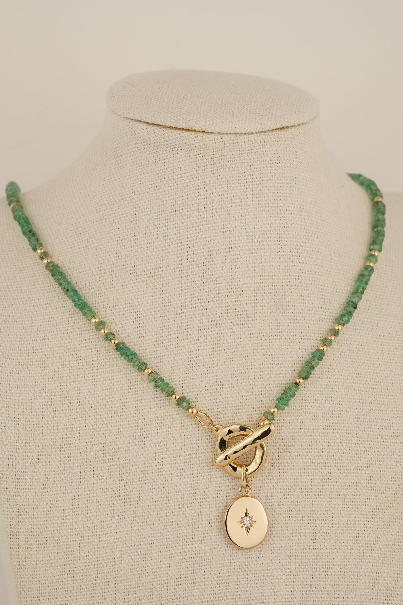 Emerald beaded necklace with solid gold toggle clasp & diamond pendant