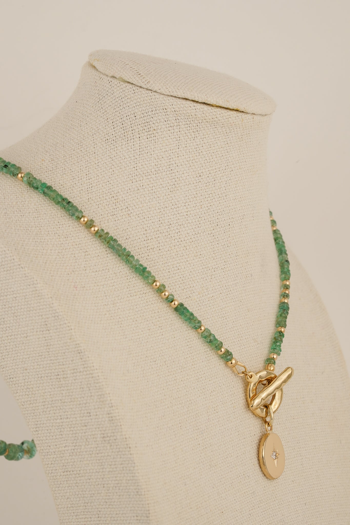 Emerald beaded necklace with solid gold toggle clasp & diamond pendant