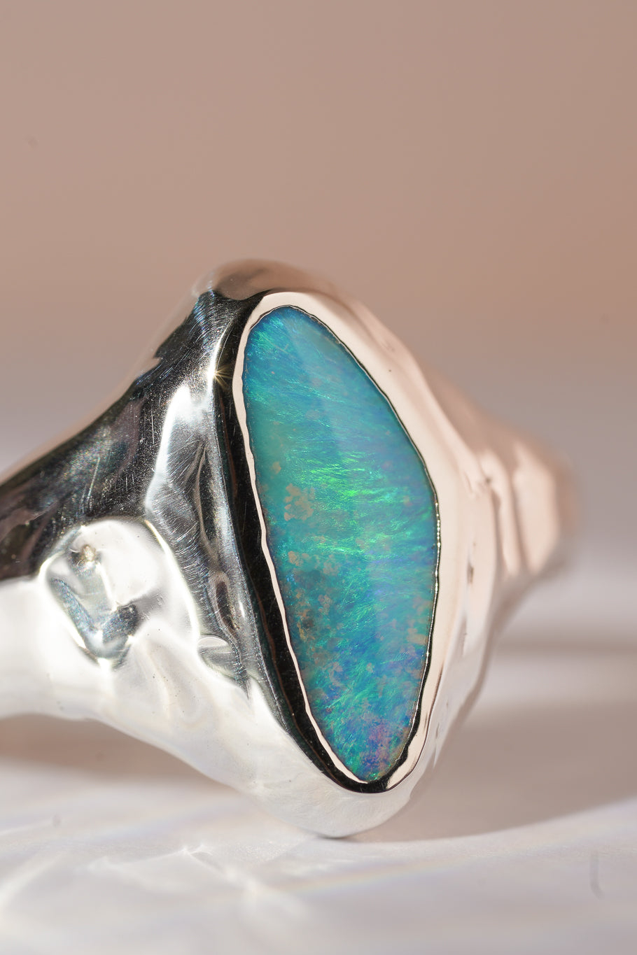 Bright blue boulder opal signet ring
