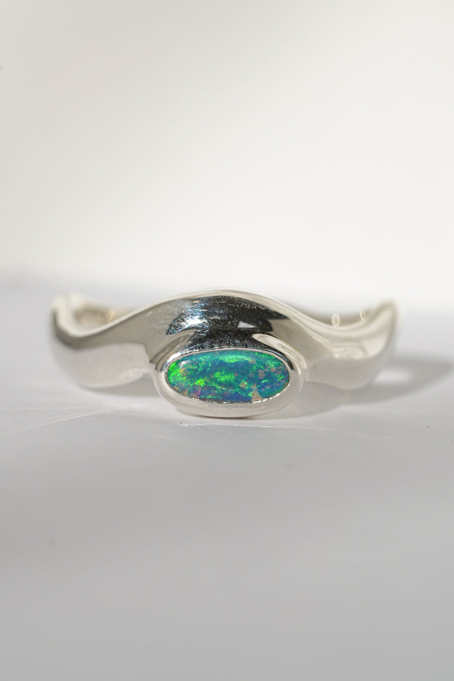 Bright green boulder opal wave ring