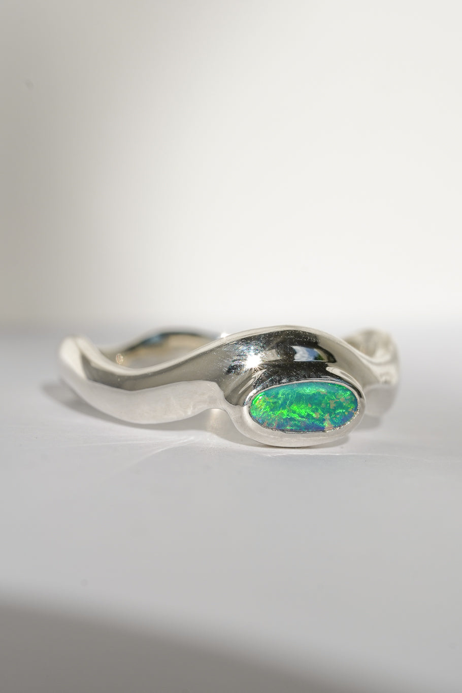 Bright green boulder opal wave ring