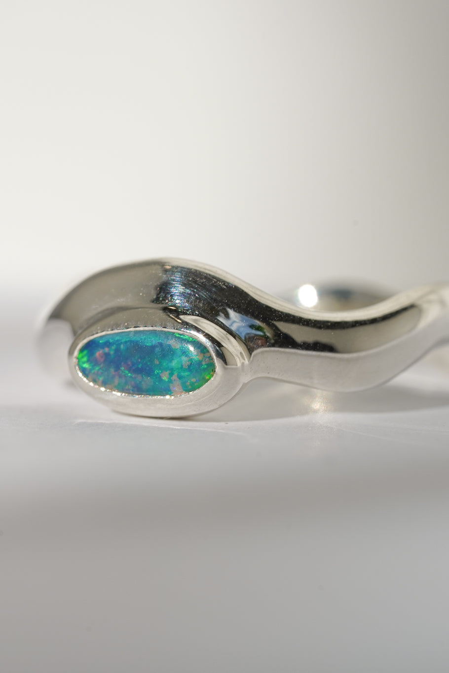 Bright green boulder opal wave ring