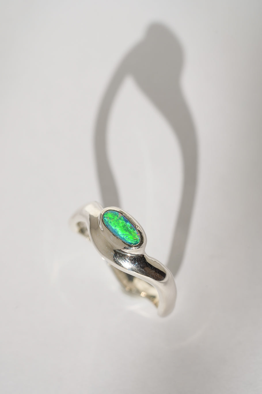 Bright green boulder opal wave ring
