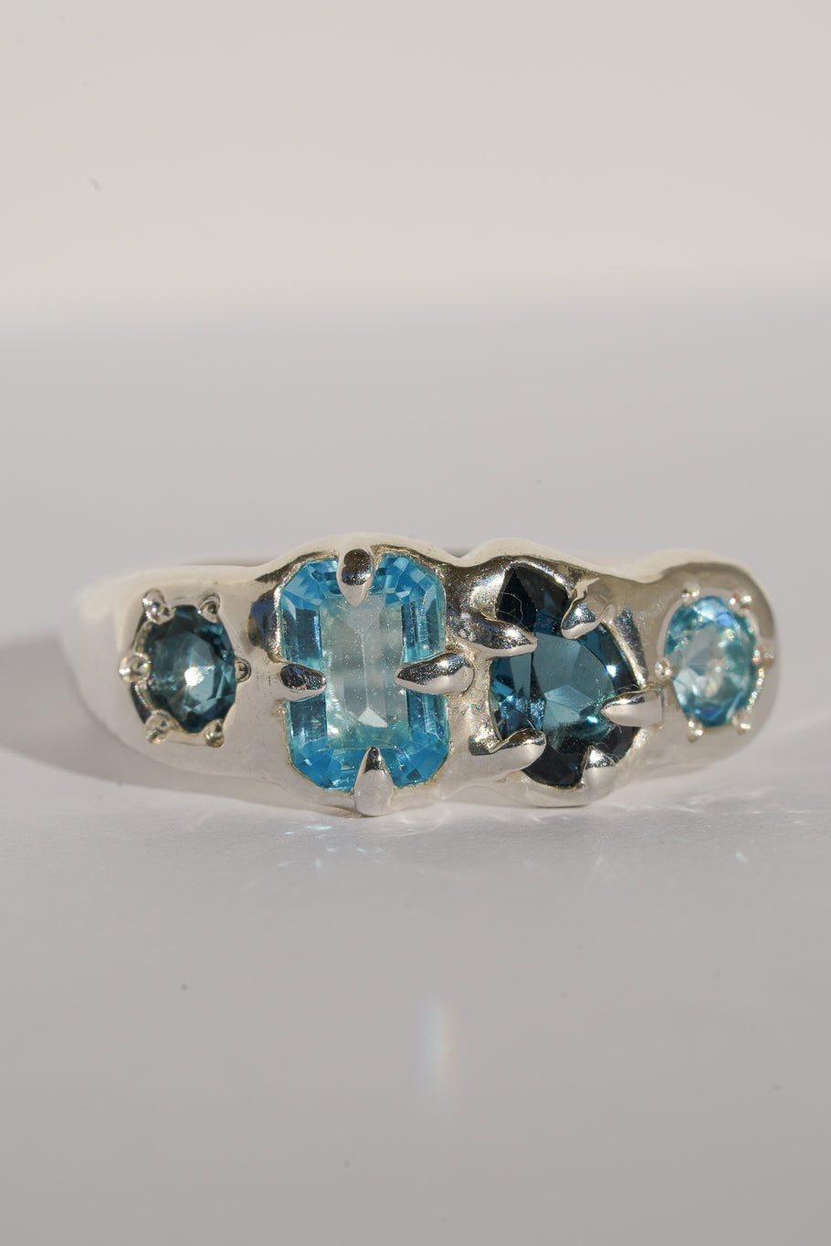 Four stone blue topaz band