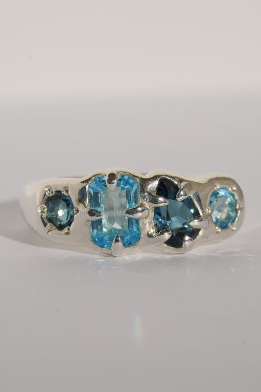 Four stone blue topaz band