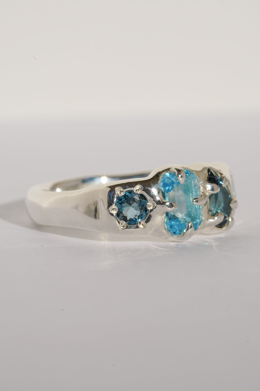 Four stone blue topaz band