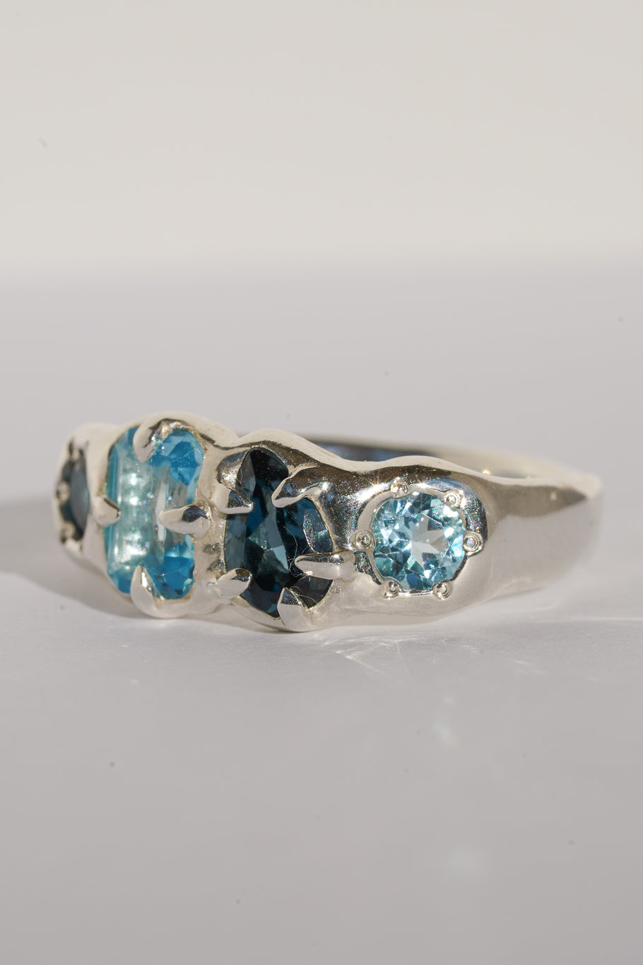 Four stone blue topaz band