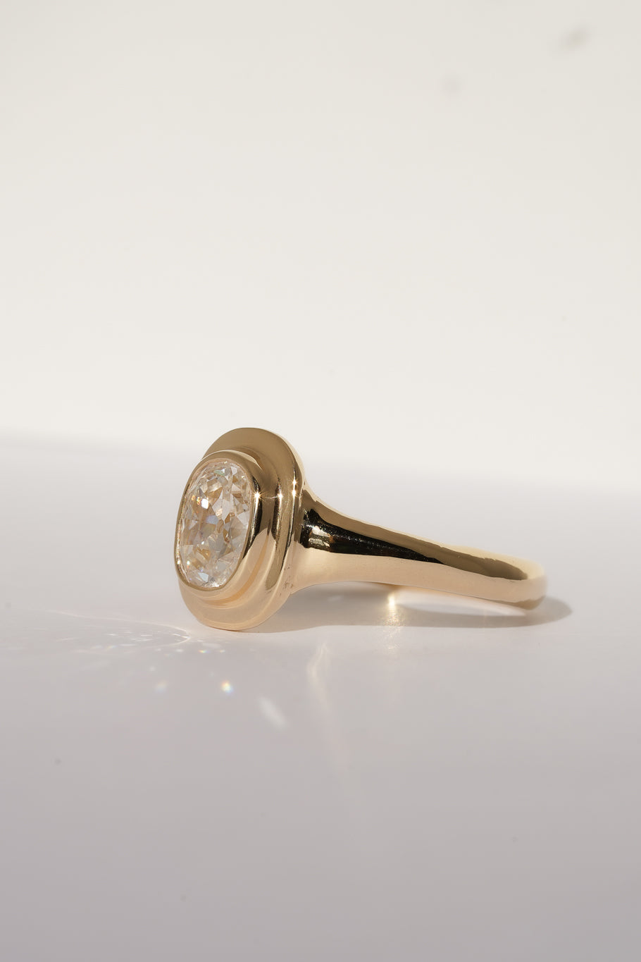 Solid gold old mine cut diamond solitare