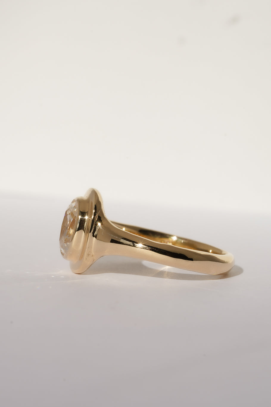 Solid gold old mine cut diamond solitare