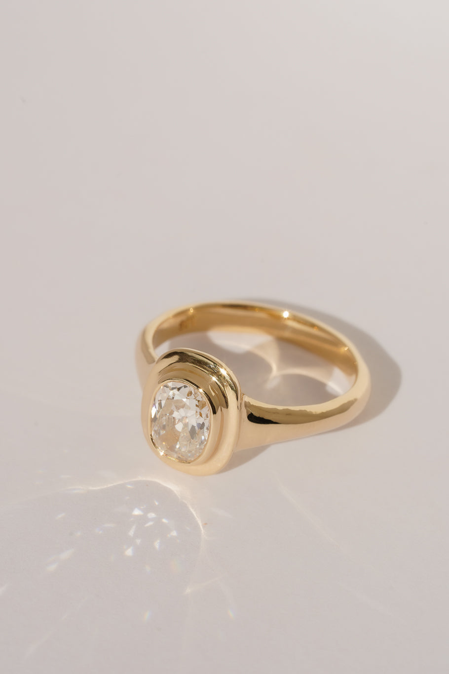 Solid gold old mine cut diamond solitare