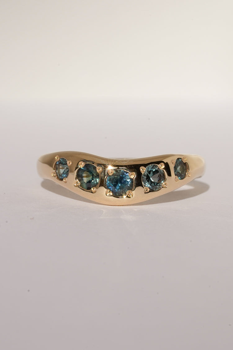 Solid gold teal sapphire stacking band